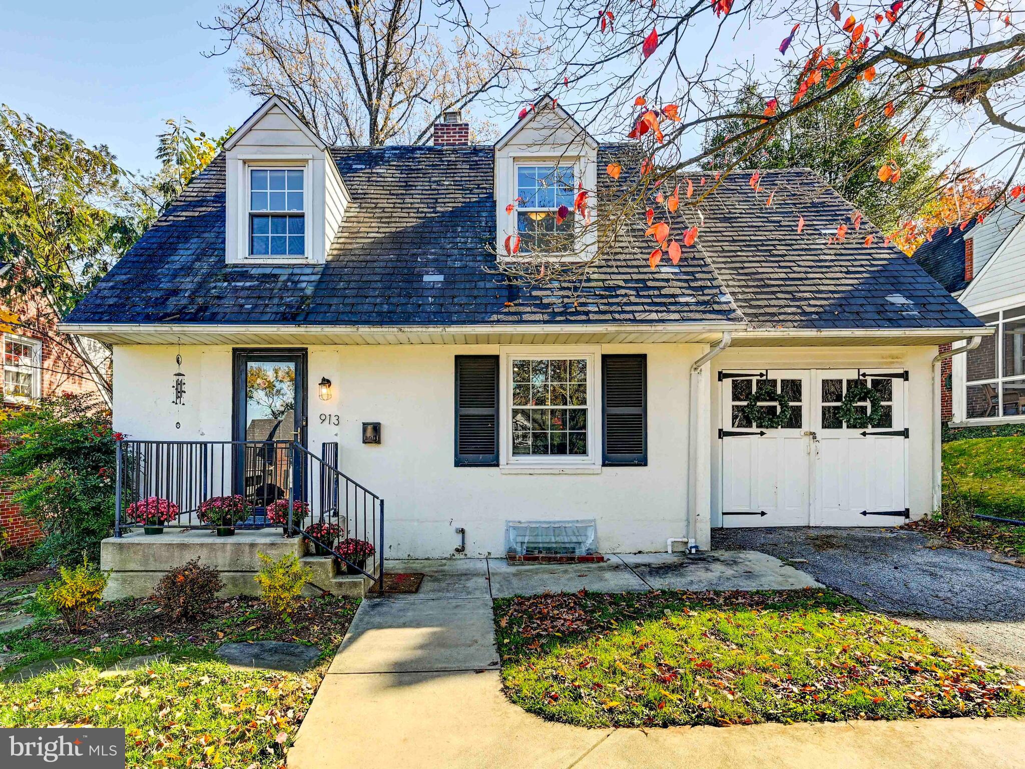 913 Adana Road Baltimore, MD 21208 - Photo 1 of 26 a front view of a house with swimming pool