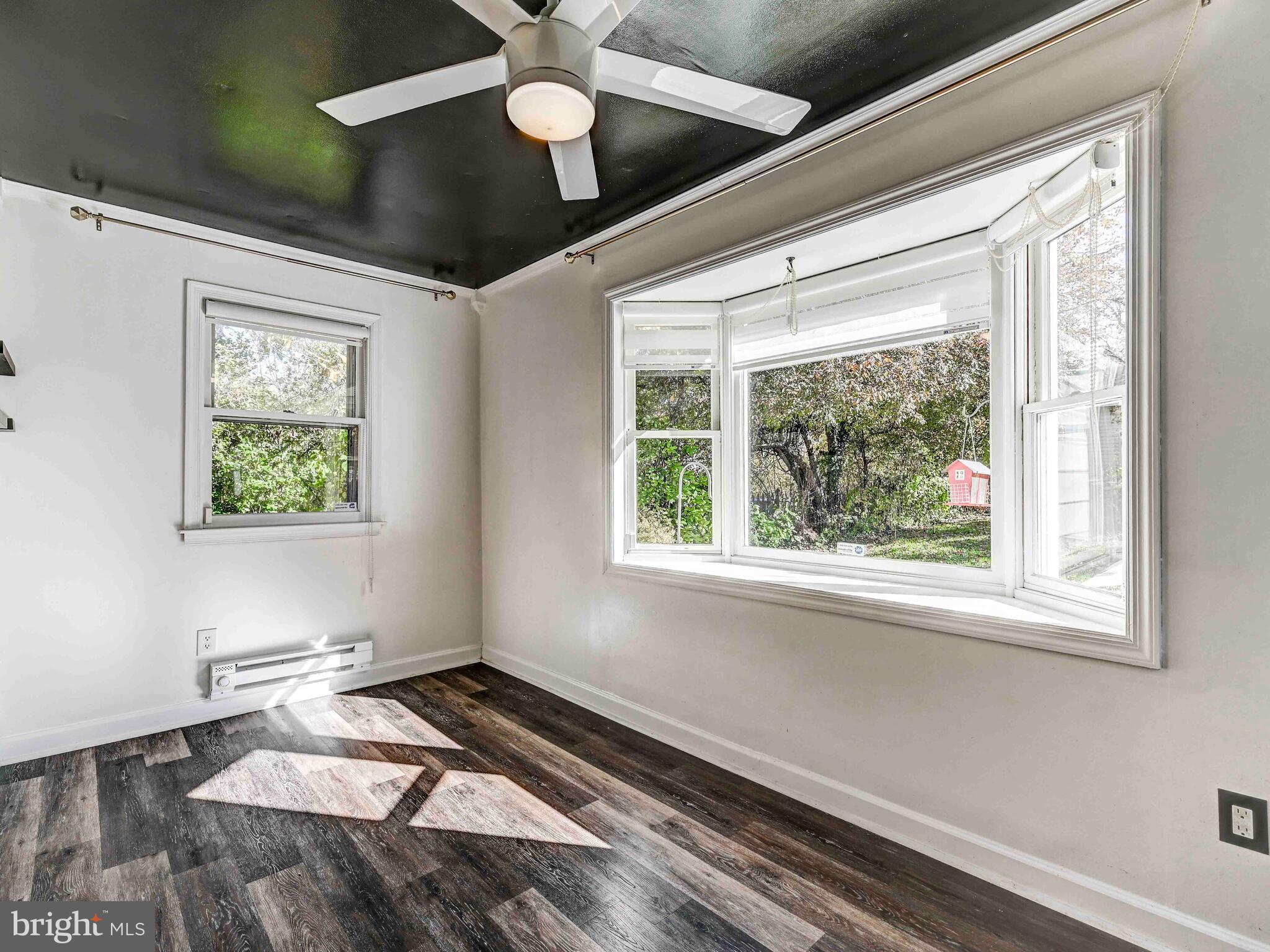 913 Adana Road Baltimore, MD 21208 - Photo 12 of 26 a room with window and a ceiling fan