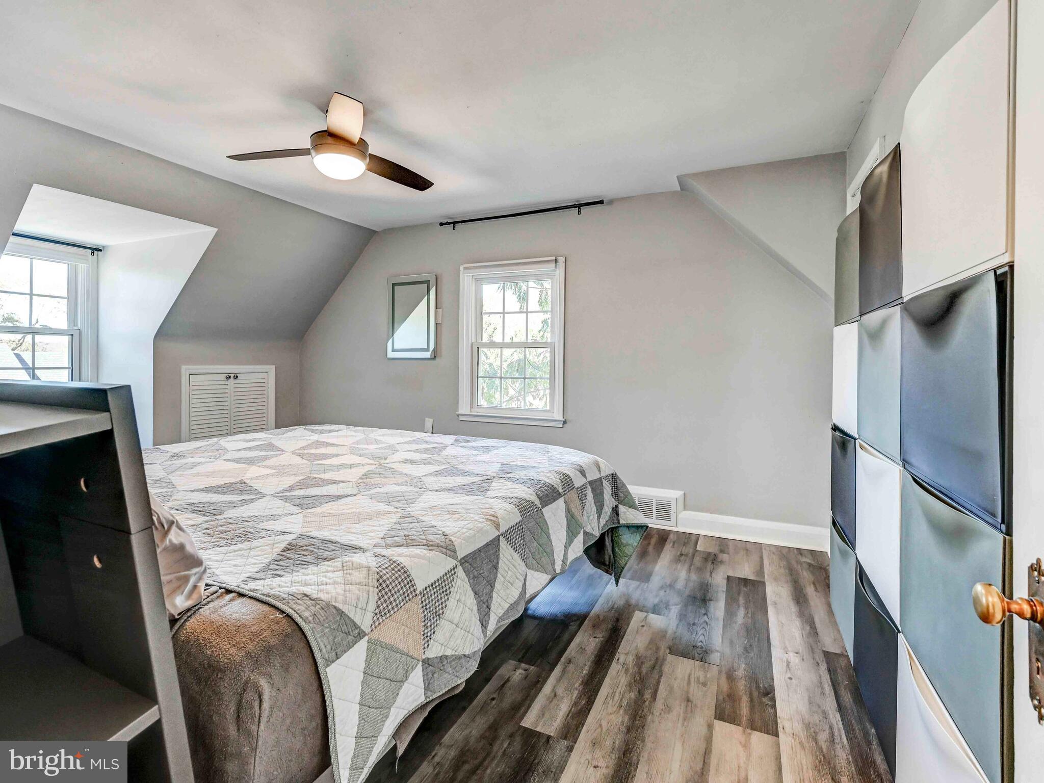 913 Adana Road Baltimore, MD 21208 - Photo 13 of 26 a bedroom with a bed and a chandelier