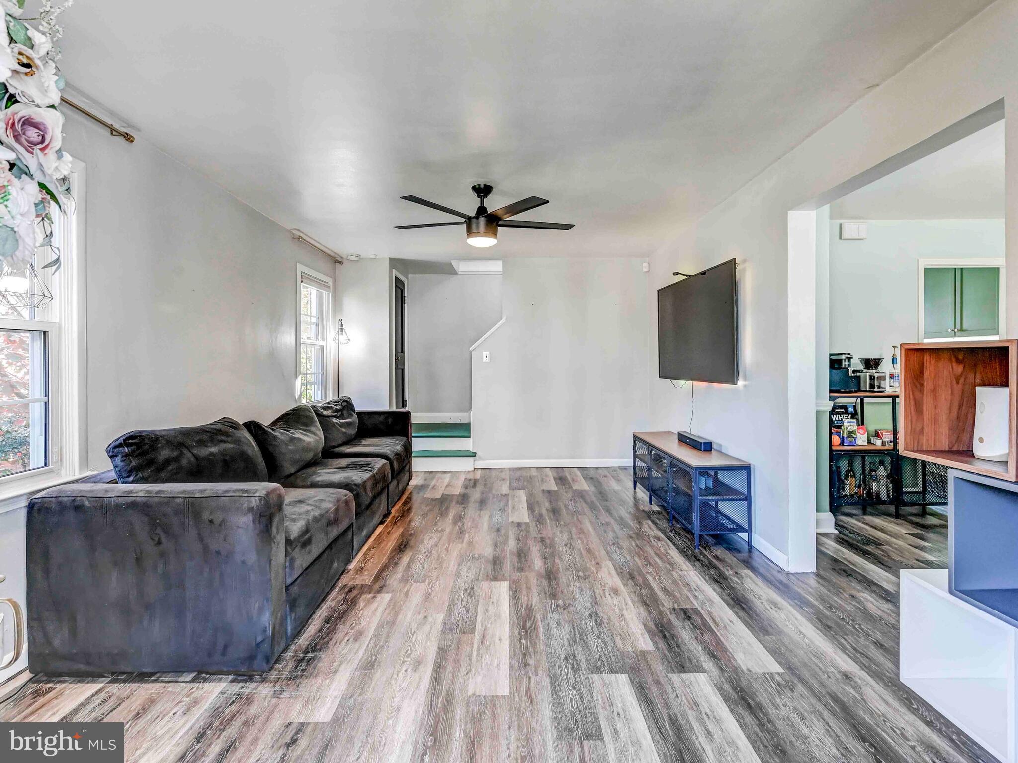 913 Adana Road Baltimore, MD 21208 - Photo 2 of 26 a living room with furniture and a flat screen tv