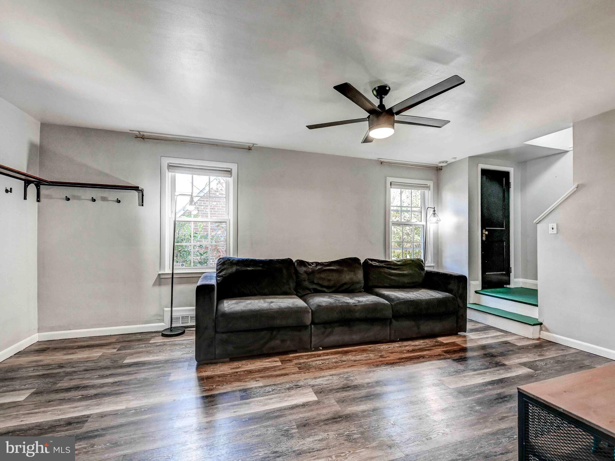 913 Adana Road Baltimore, MD 21208 - Photo 3 of 26 a living room with furniture and a wooden floor