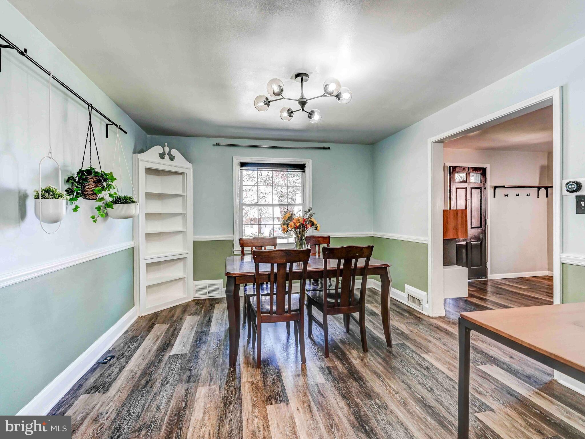 913 Adana Road Baltimore, MD 21208 - Photo 8 of 26 a view of a dining room with furniture and chandelier