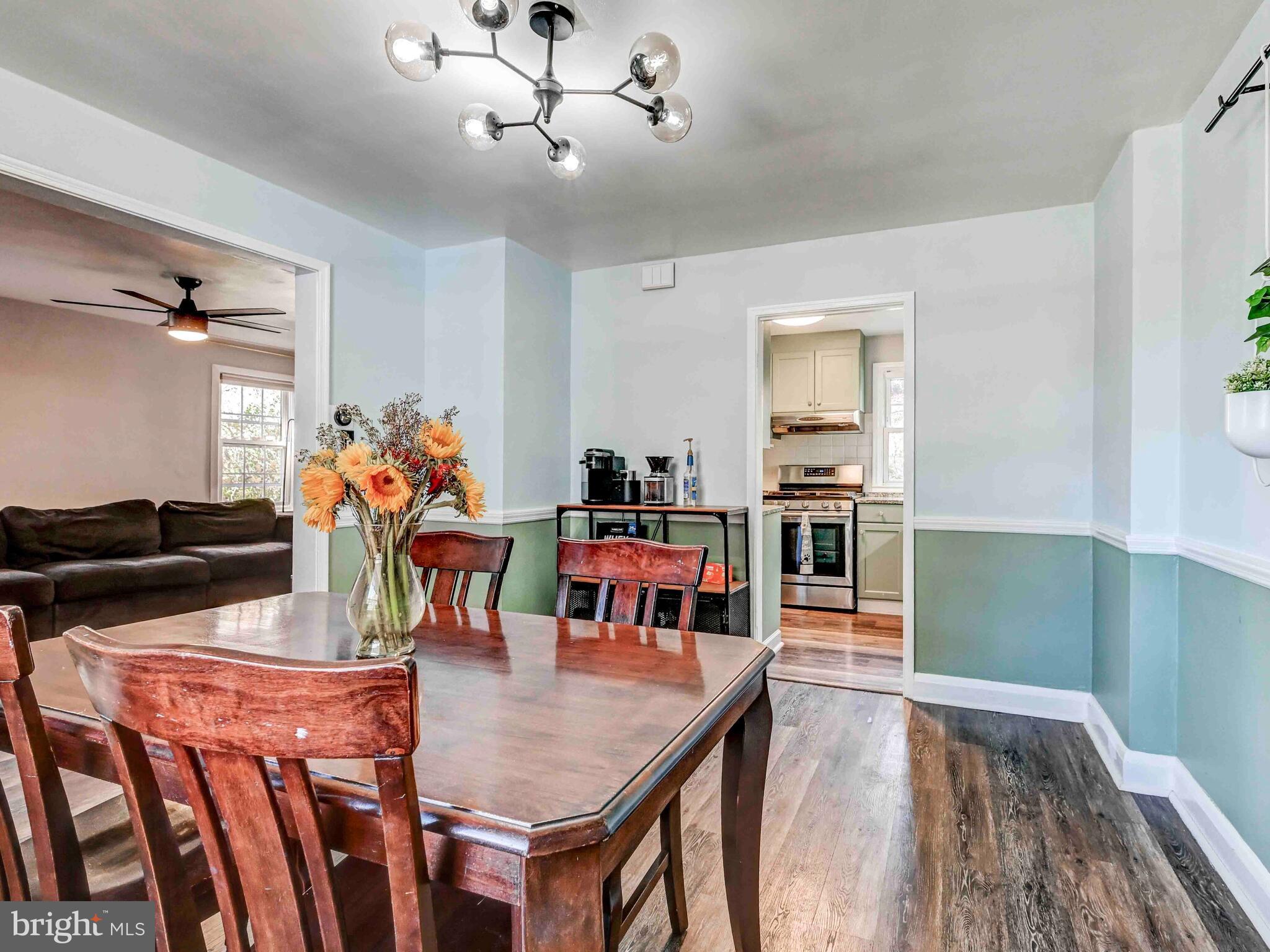 913 Adana Road Baltimore, MD 21208 - Photo 9 of 26 a dining room with furniture and wooden floor