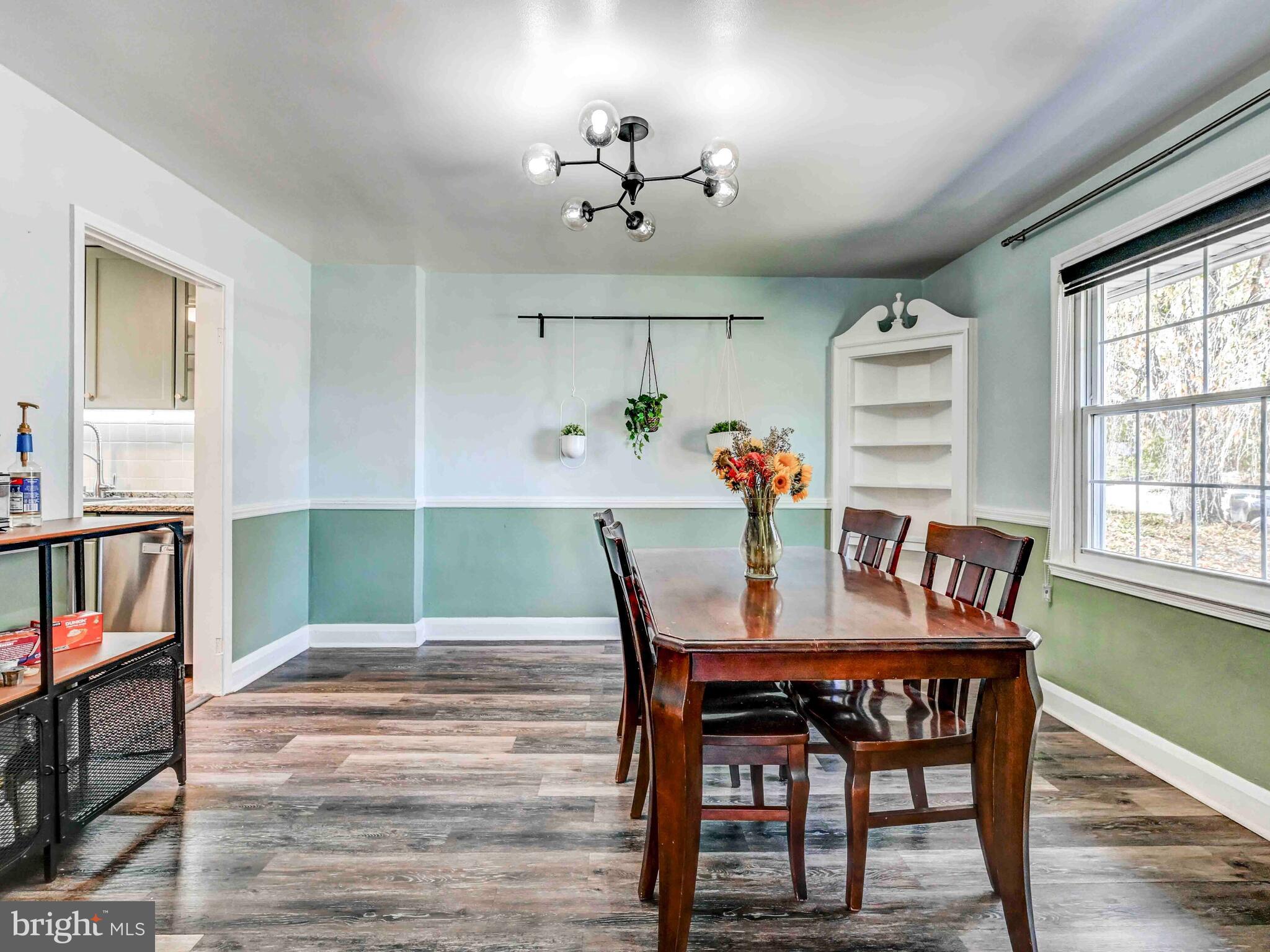 913 Adana Road Baltimore, MD 21208 - Photo 10 of 26 a view of a dining room with furniture window and wooden floor