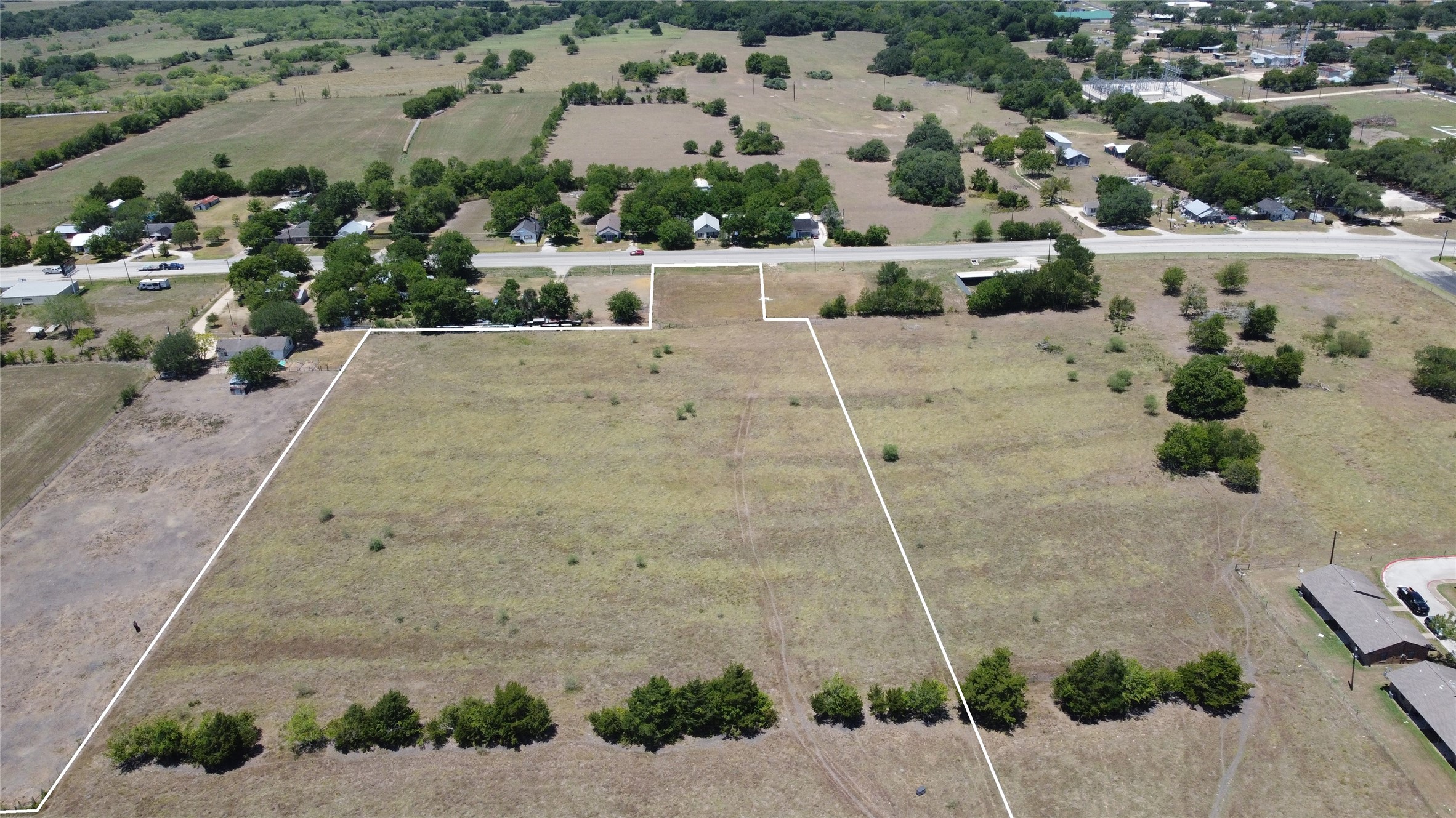 0 Highway 77 Schulenburg, TX 78956 - Photo 11 of 11 an aerial view of a house with a yard