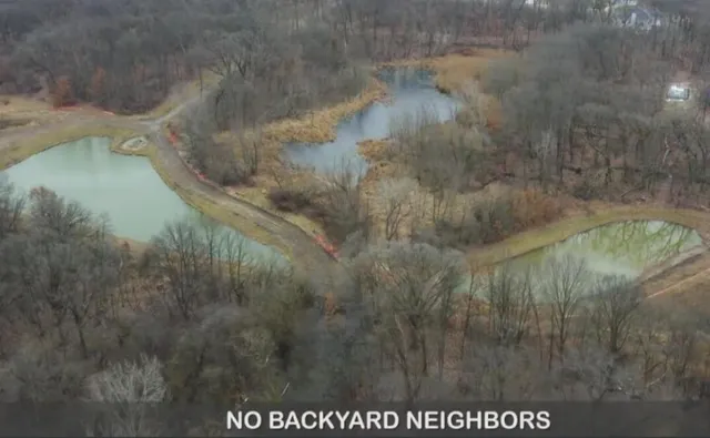 a front view of a house with a yard table and chairs