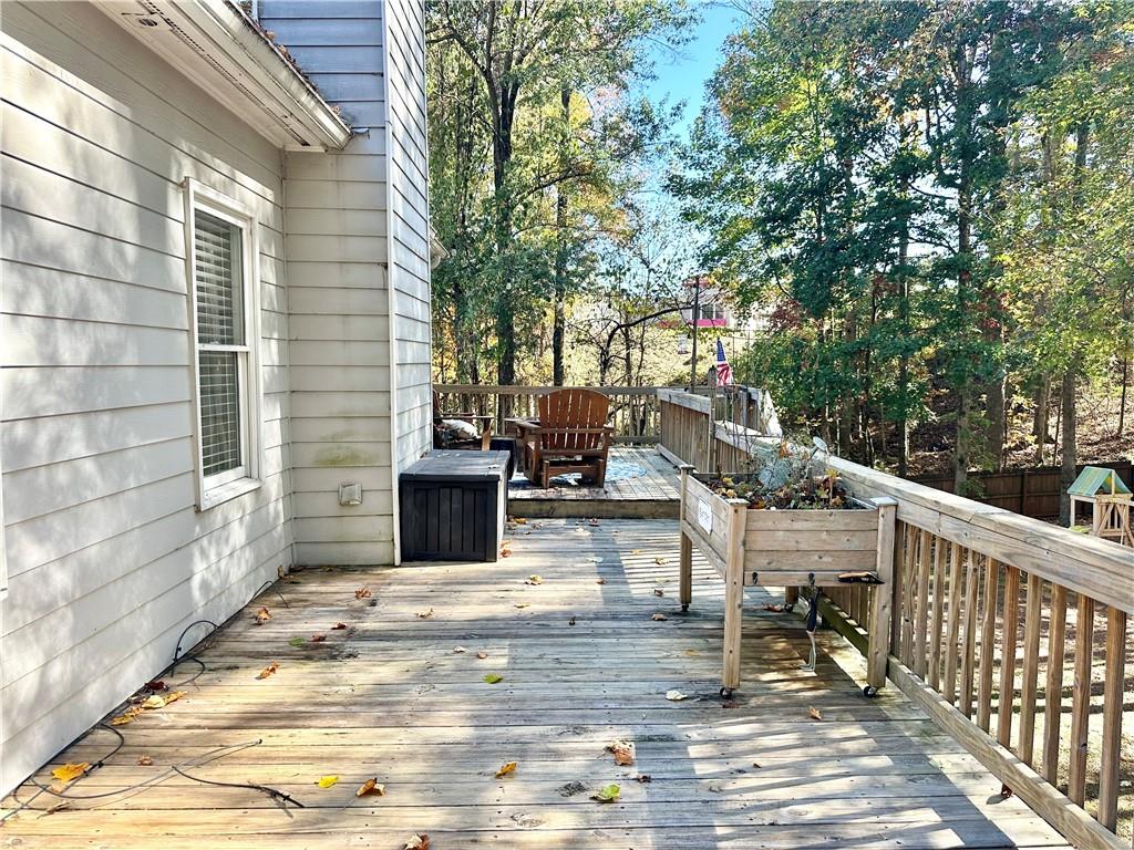 2533 Gold Hill Court Villa Rica, GA 30180 - Photo 19 of 50 a view of a patio with chairs and wooden fence