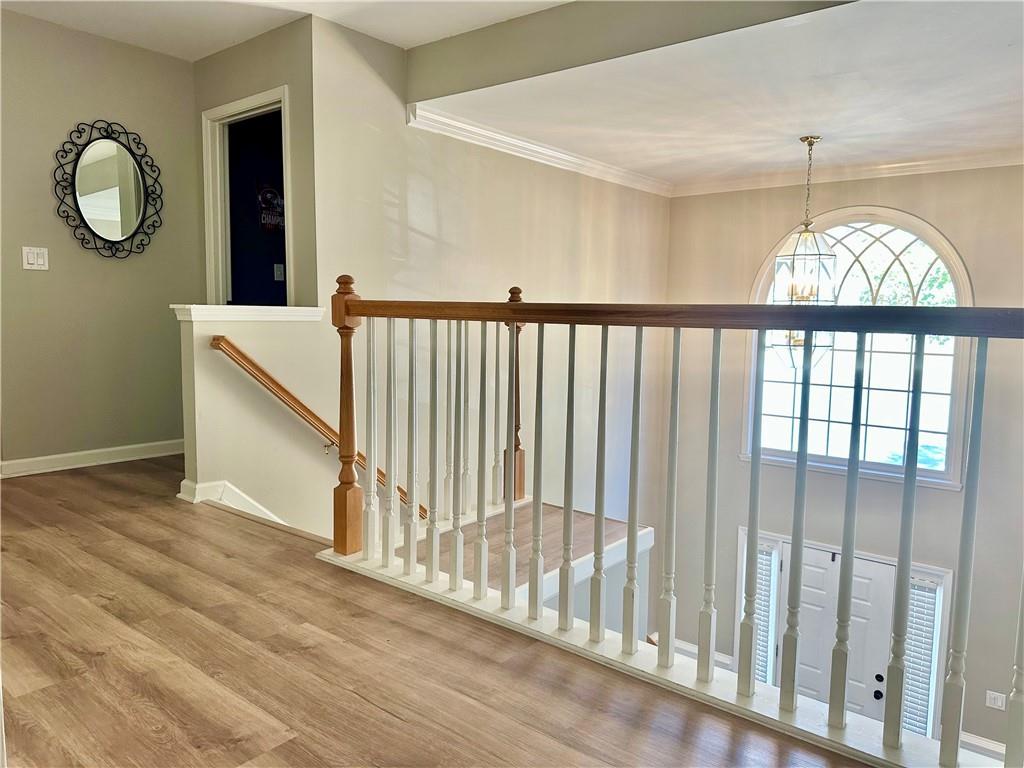 2533 Gold Hill Court Villa Rica, GA 30180 - Photo 38 of 50 a view of a hallway to a dining room with wooden floor and fan
