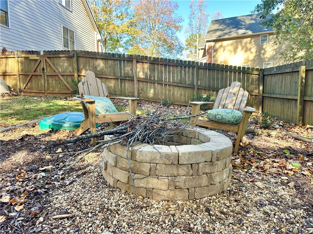 2533 Gold Hill Court Villa Rica, GA 30180 - Photo 46 of 50 a view of a chair and table in backyard
