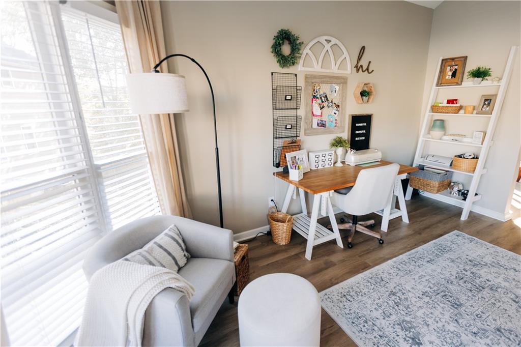 2533 Gold Hill Court Villa Rica, GA 30180 - Photo 7 of 50 a living room with furniture a rug and a large window