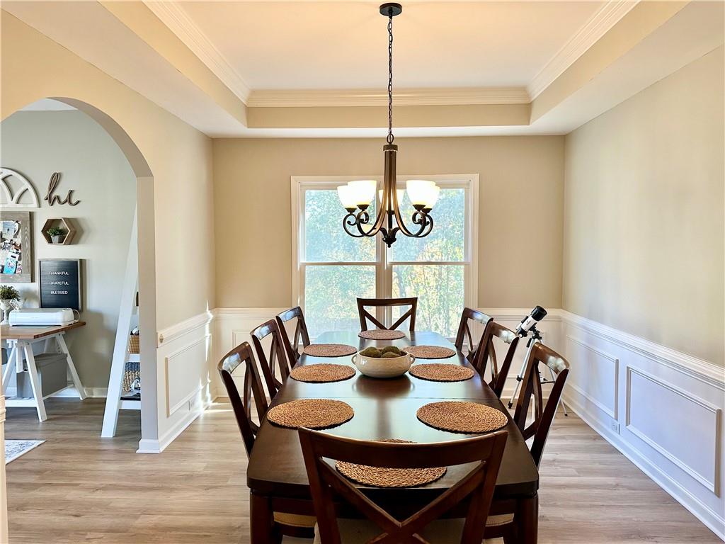 2533 Gold Hill Court Villa Rica, GA 30180 - Photo 9 of 50 a view of a dining room with furniture wooden floor and chandelier