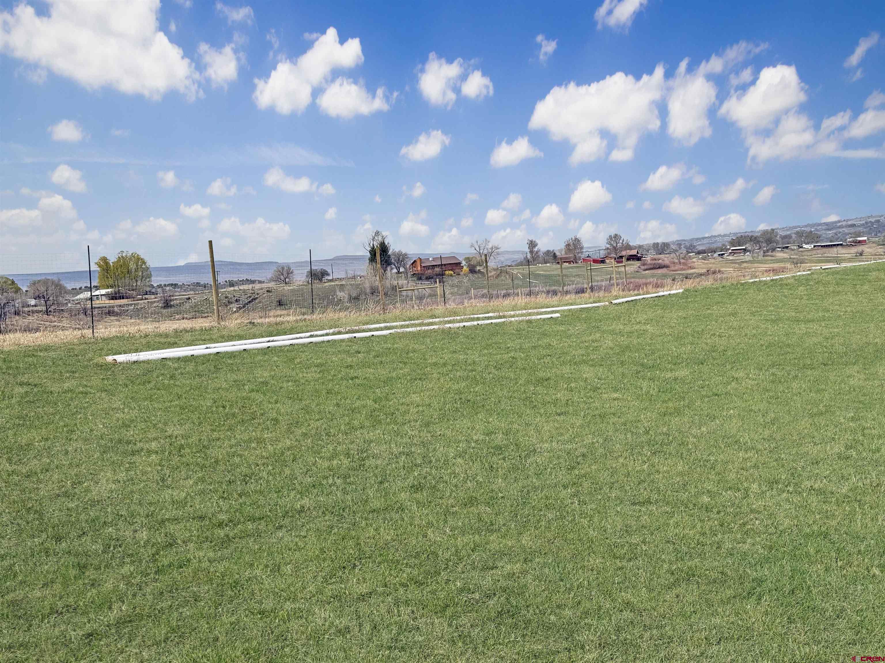 11545 Crawford Road Paonia, CO 81428 - Photo 13 of 45 a view of a lake with houses in the background