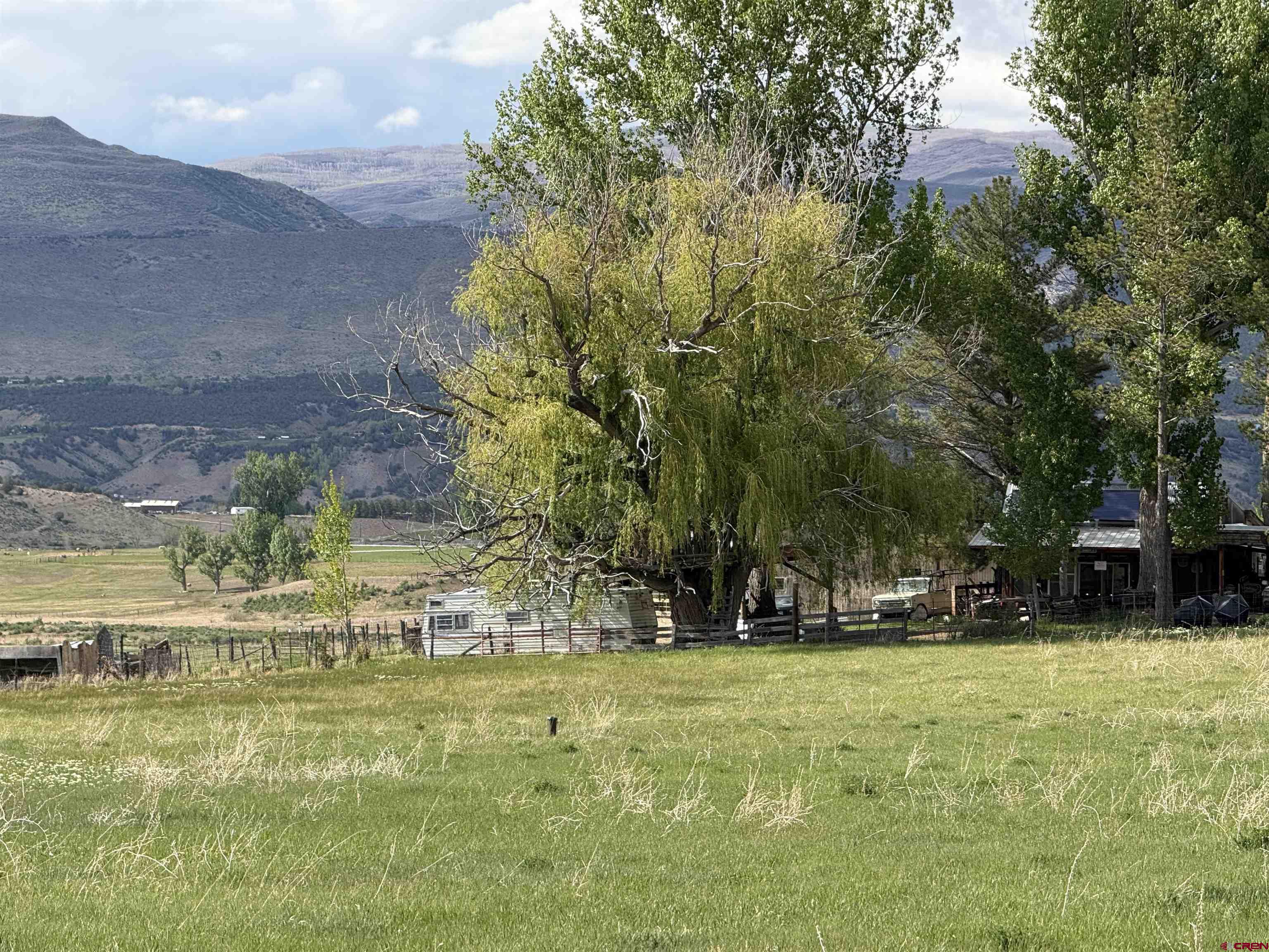 11545 Crawford Road Paonia, CO 81428 - Photo 14 of 45 a view of swimming pool with outdoor seating and yard
