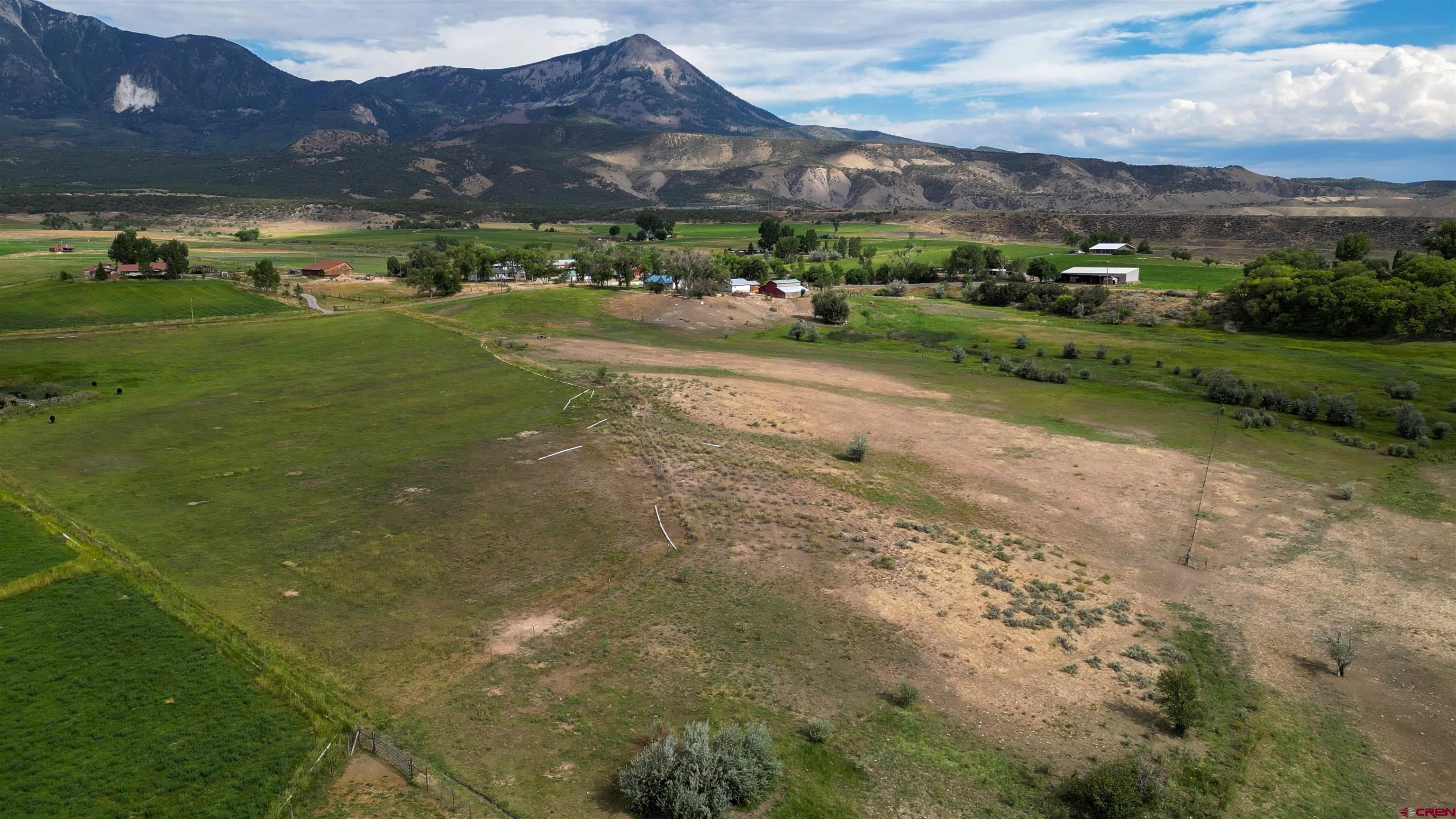 11545 Crawford Road Paonia, CO 81428 - Photo 18 of 45 a view of a town with mountains in the background