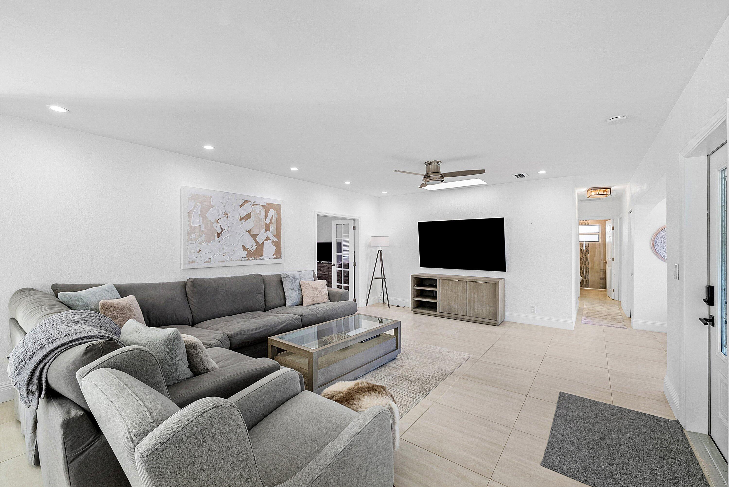 124 Oregon Lane Boca Raton, FL 33487 - Photo 12 of 41 a living room with furniture and a flat screen tv