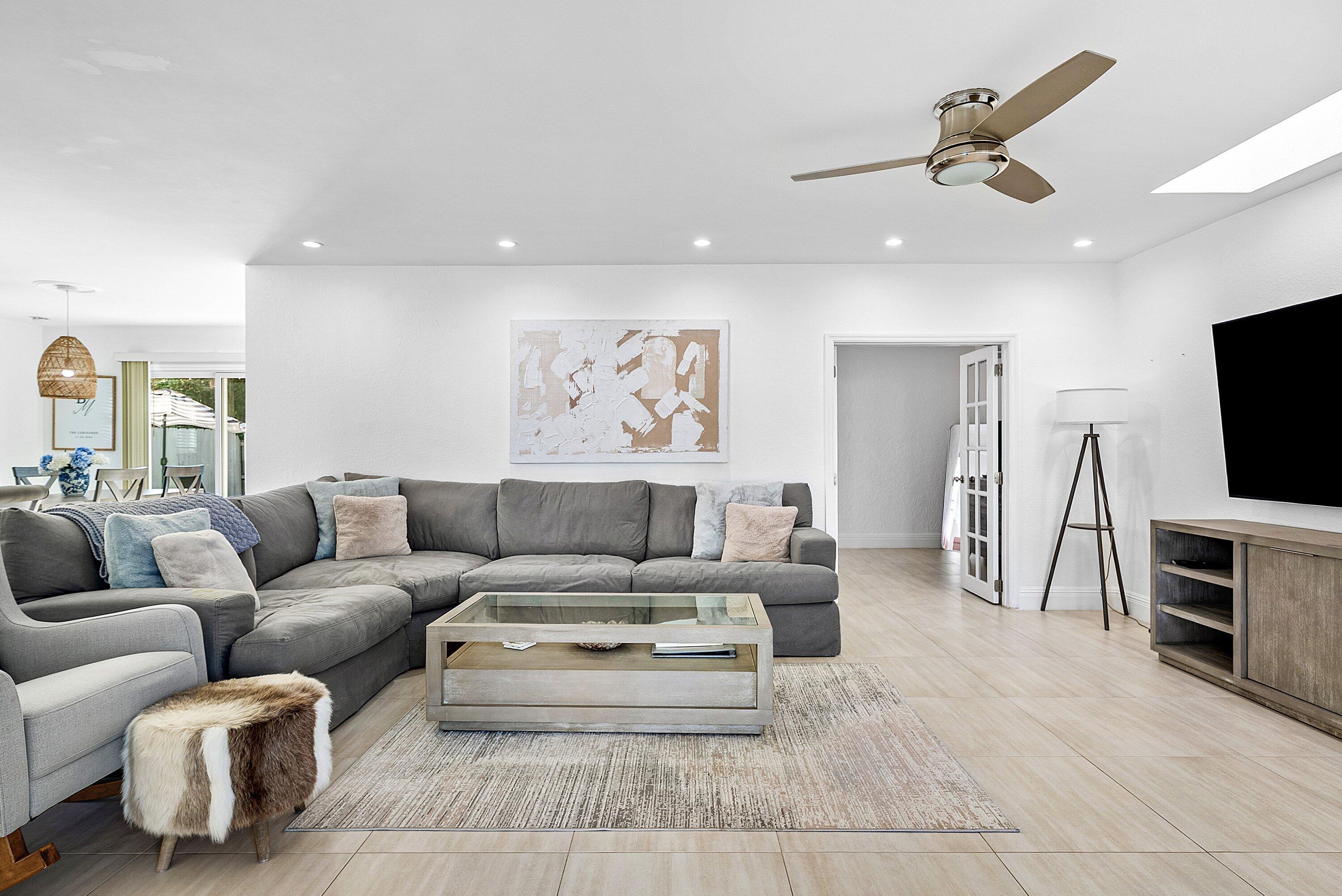 124 Oregon Lane Boca Raton, FL 33487 - Photo 13 of 41 a living room with furniture and a flat screen tv