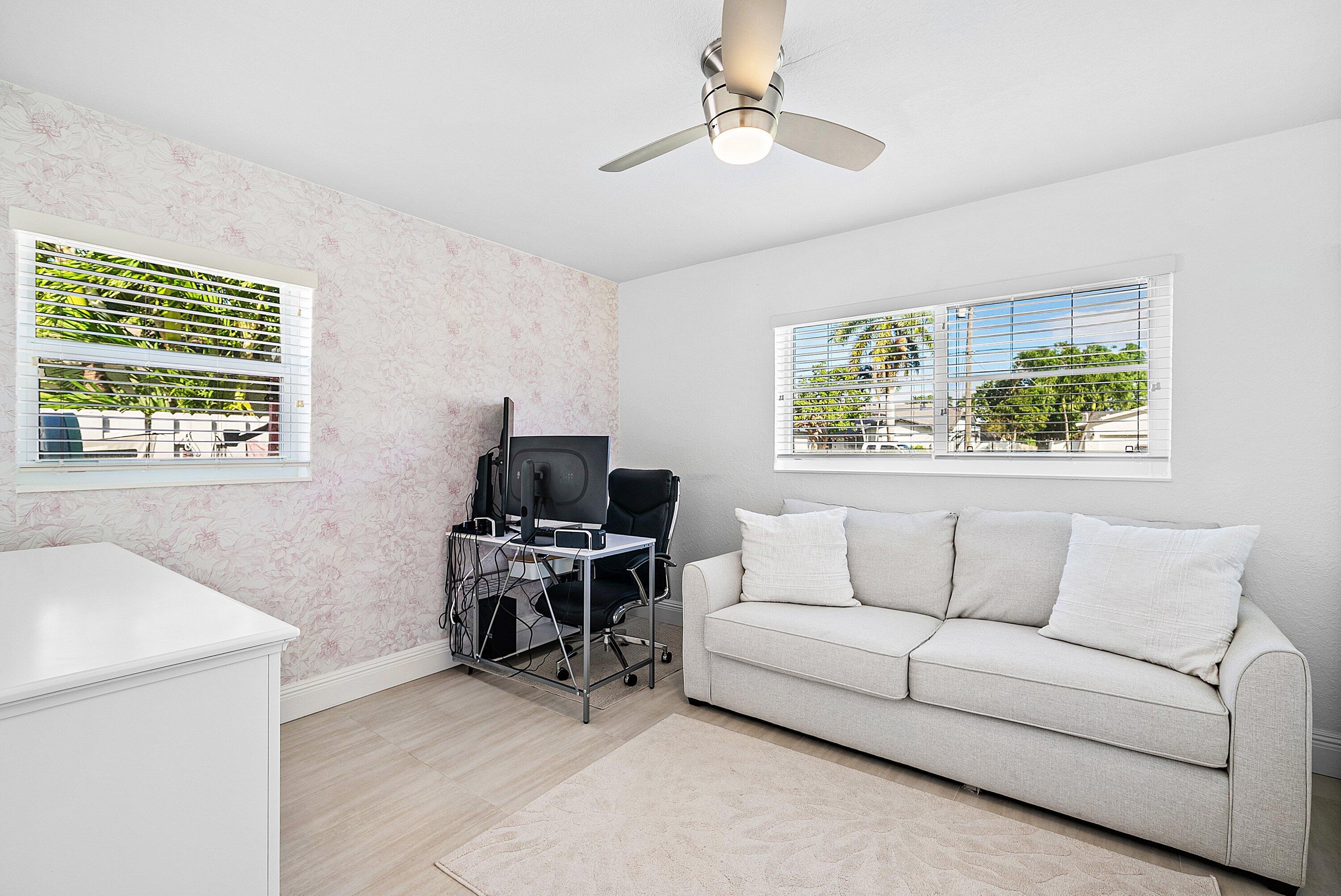 124 Oregon Lane Boca Raton, FL 33487 - Photo 18 of 41 a living room with furniture and a window