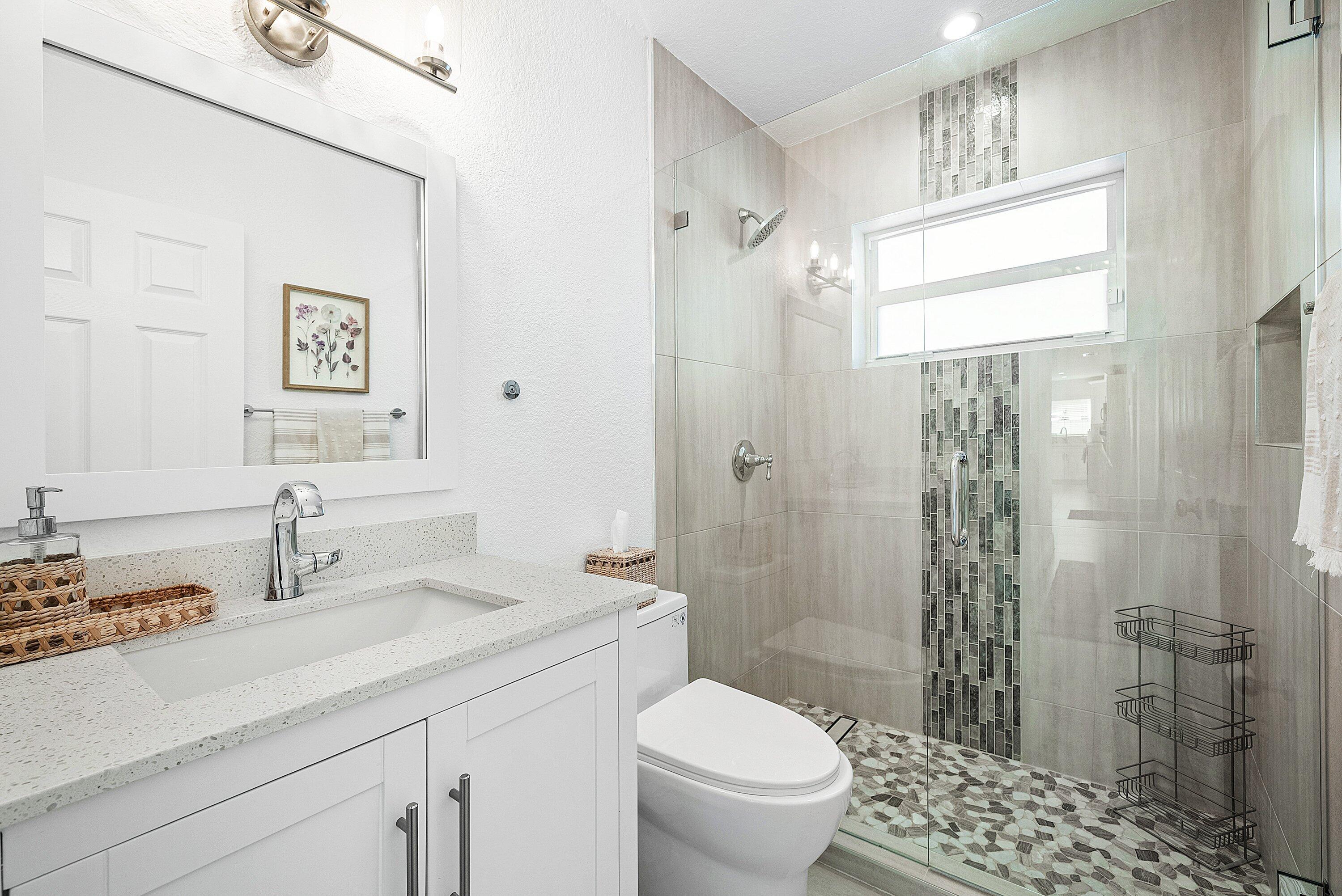 124 Oregon Lane Boca Raton, FL 33487 - Photo 19 of 41 a bathroom with a sink a toilet and shower