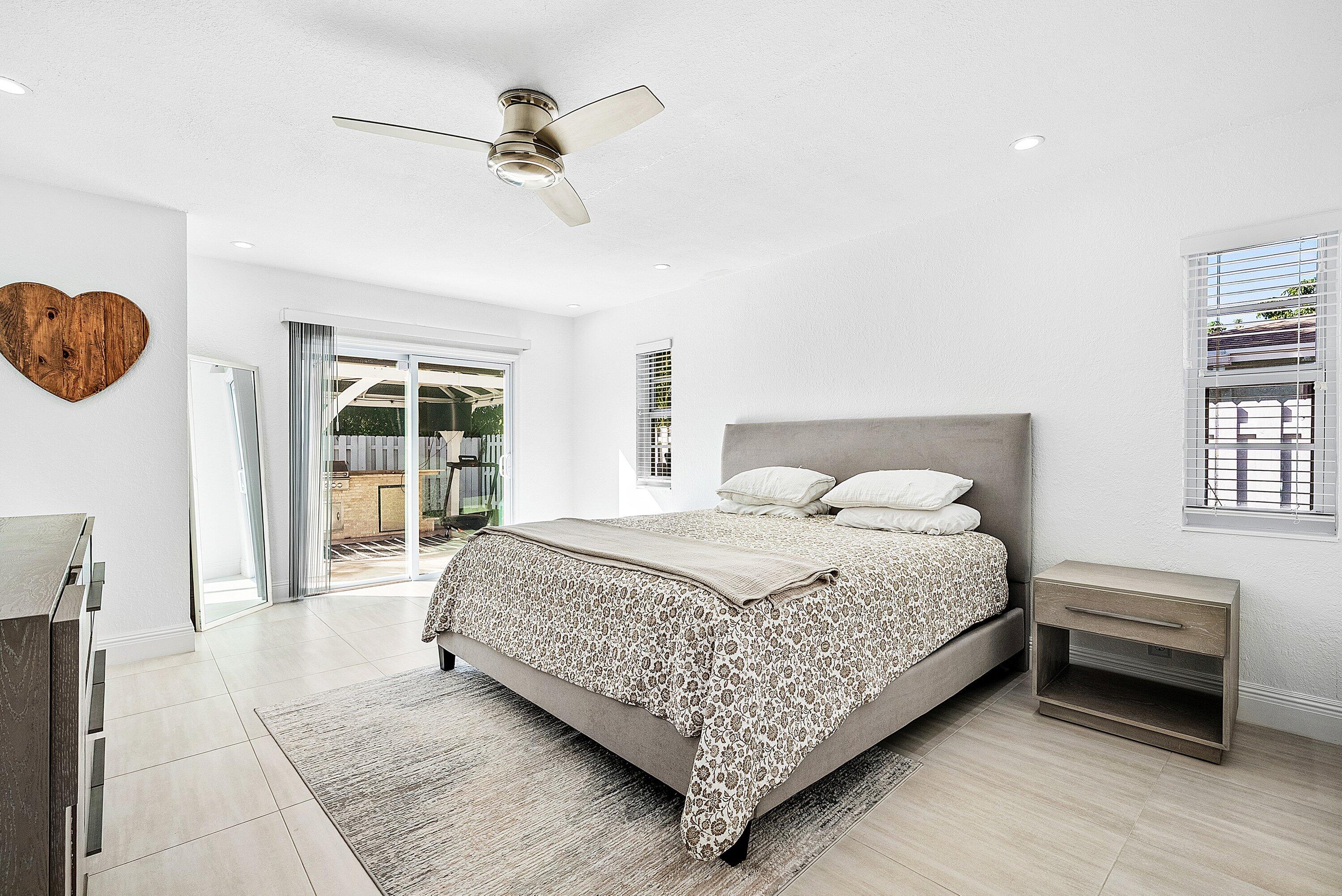 124 Oregon Lane Boca Raton, FL 33487 - Photo 20 of 41 a bedroom with a bed and a window