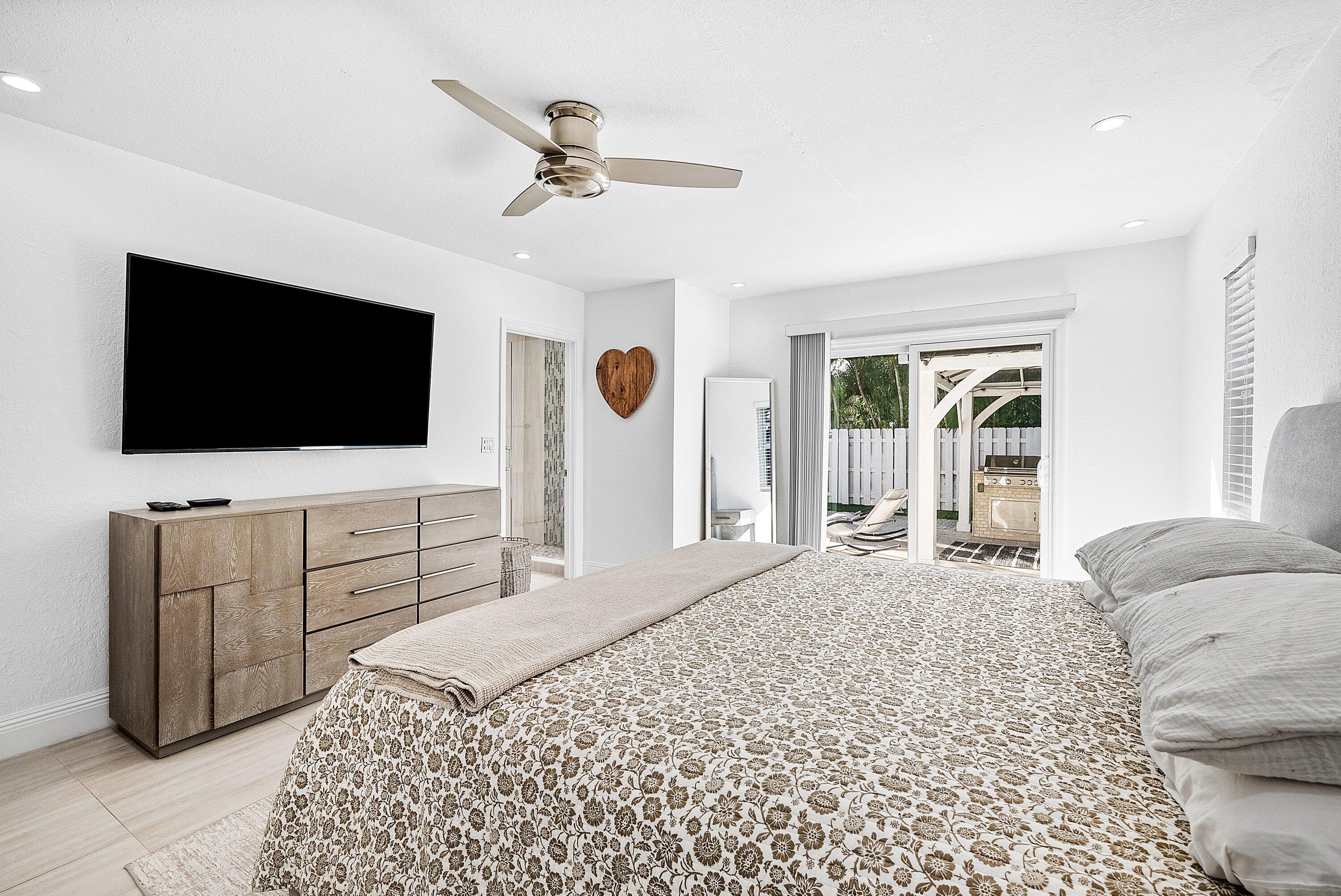 124 Oregon Lane Boca Raton, FL 33487 - Photo 21 of 41 a bedroom with a bed and a flat screen tv