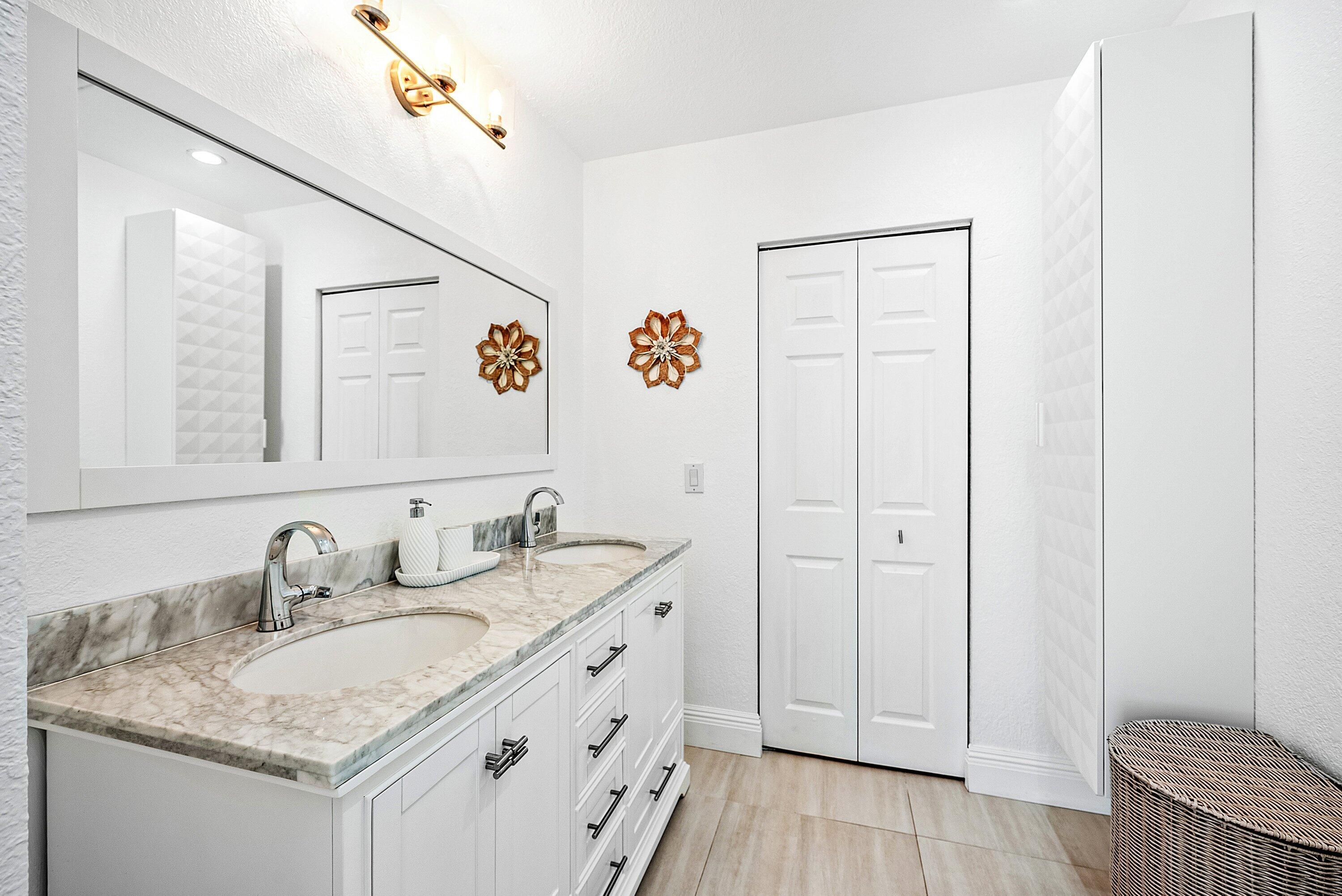 124 Oregon Lane Boca Raton, FL 33487 - Photo 24 of 41 a bathroom with a granite countertop sink and a mirror