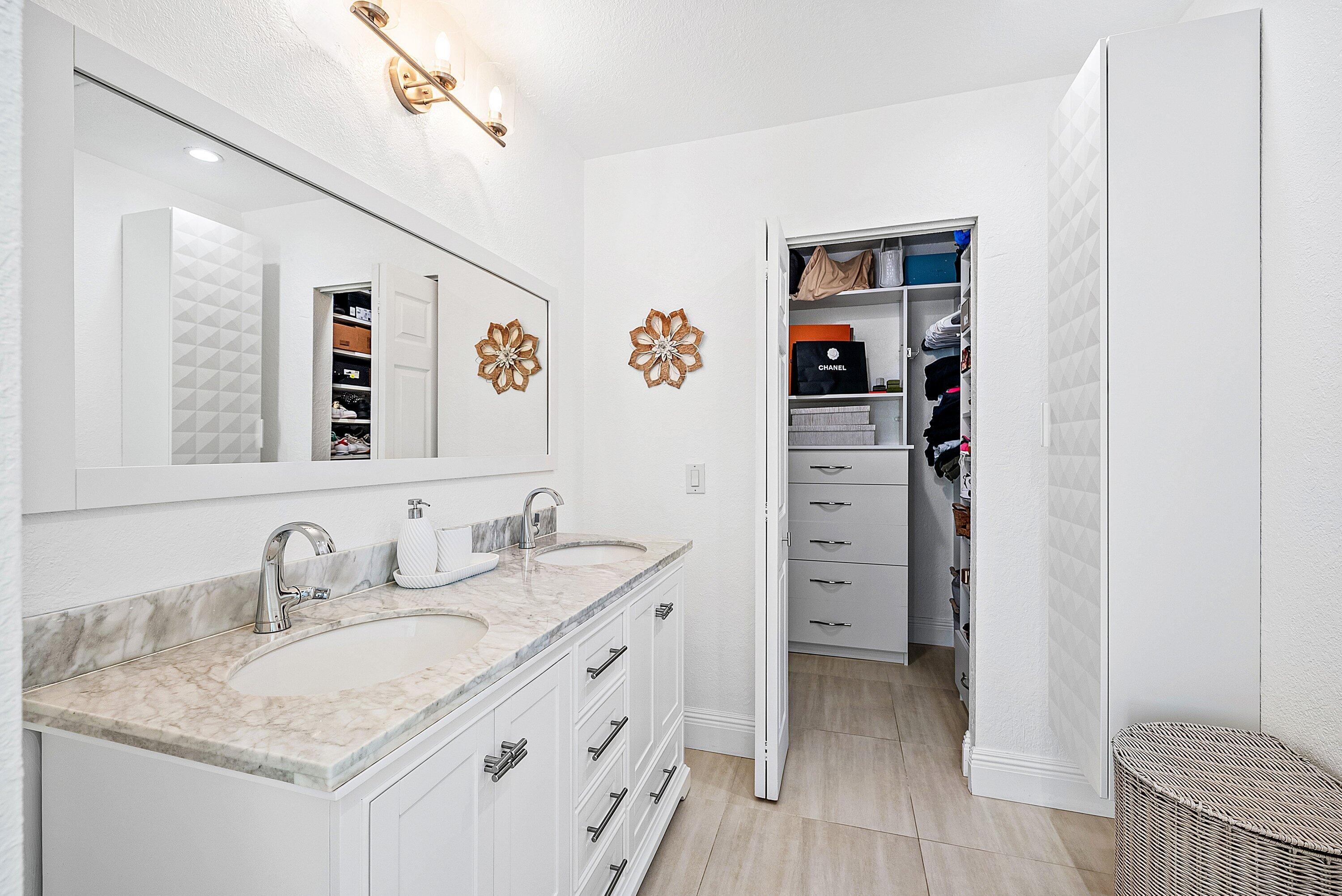 124 Oregon Lane Boca Raton, FL 33487 - Photo 25 of 41 a bathroom with a granite countertop sink and a mirror