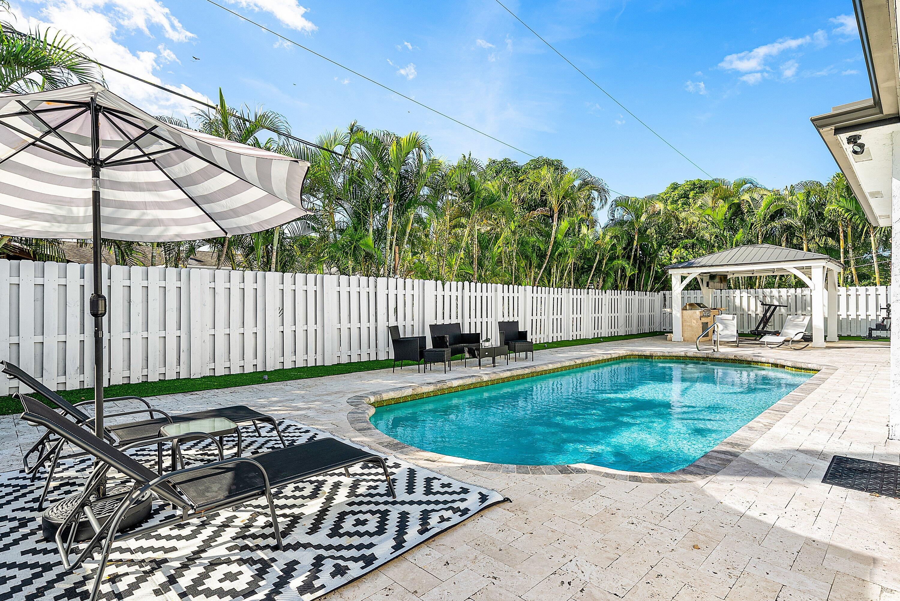 124 Oregon Lane Boca Raton, FL 33487 - Photo 3 of 41 a view of a backyard with sitting area