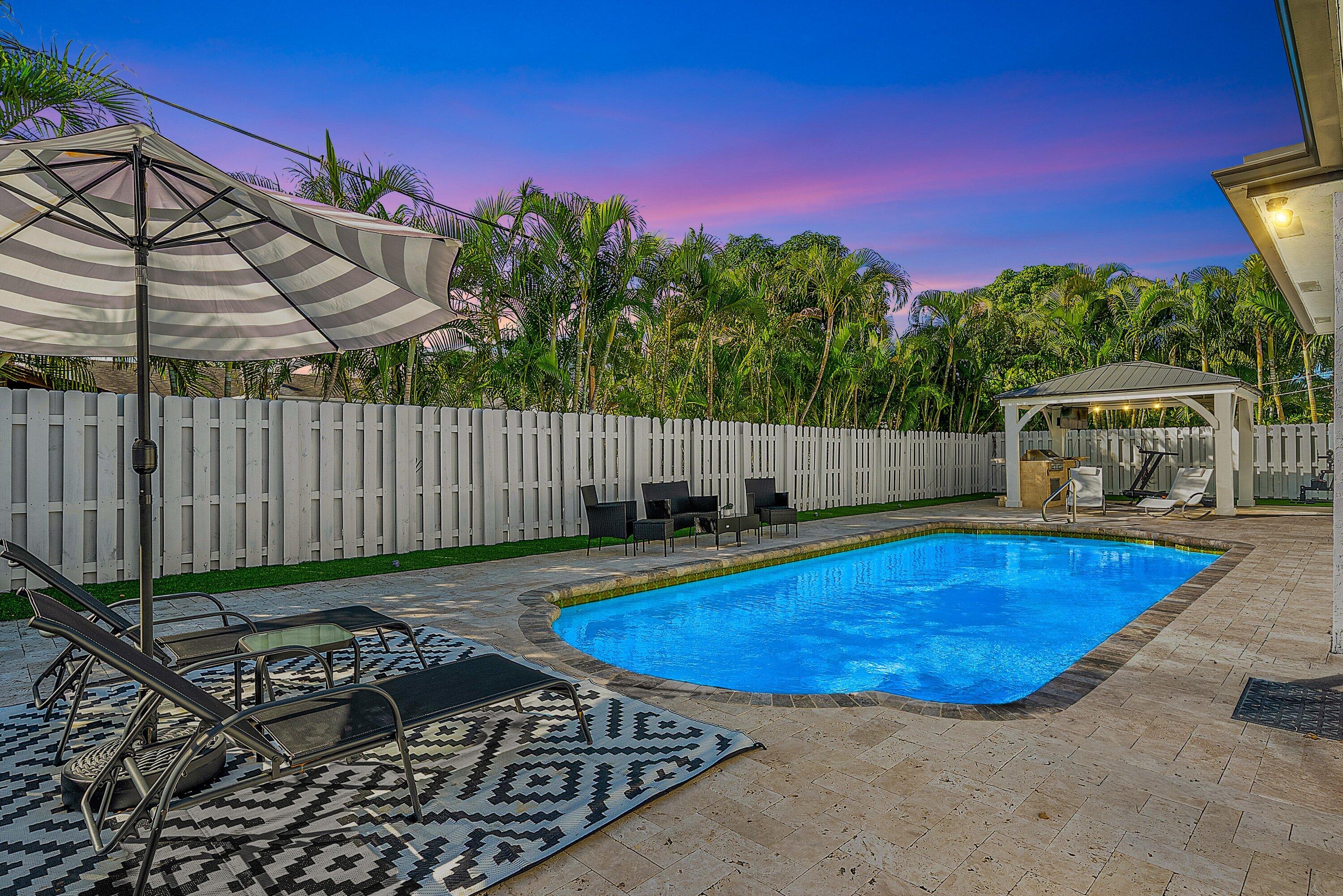 124 Oregon Lane Boca Raton, FL 33487 - Photo 4 of 41 a view of a mini pool with a yard