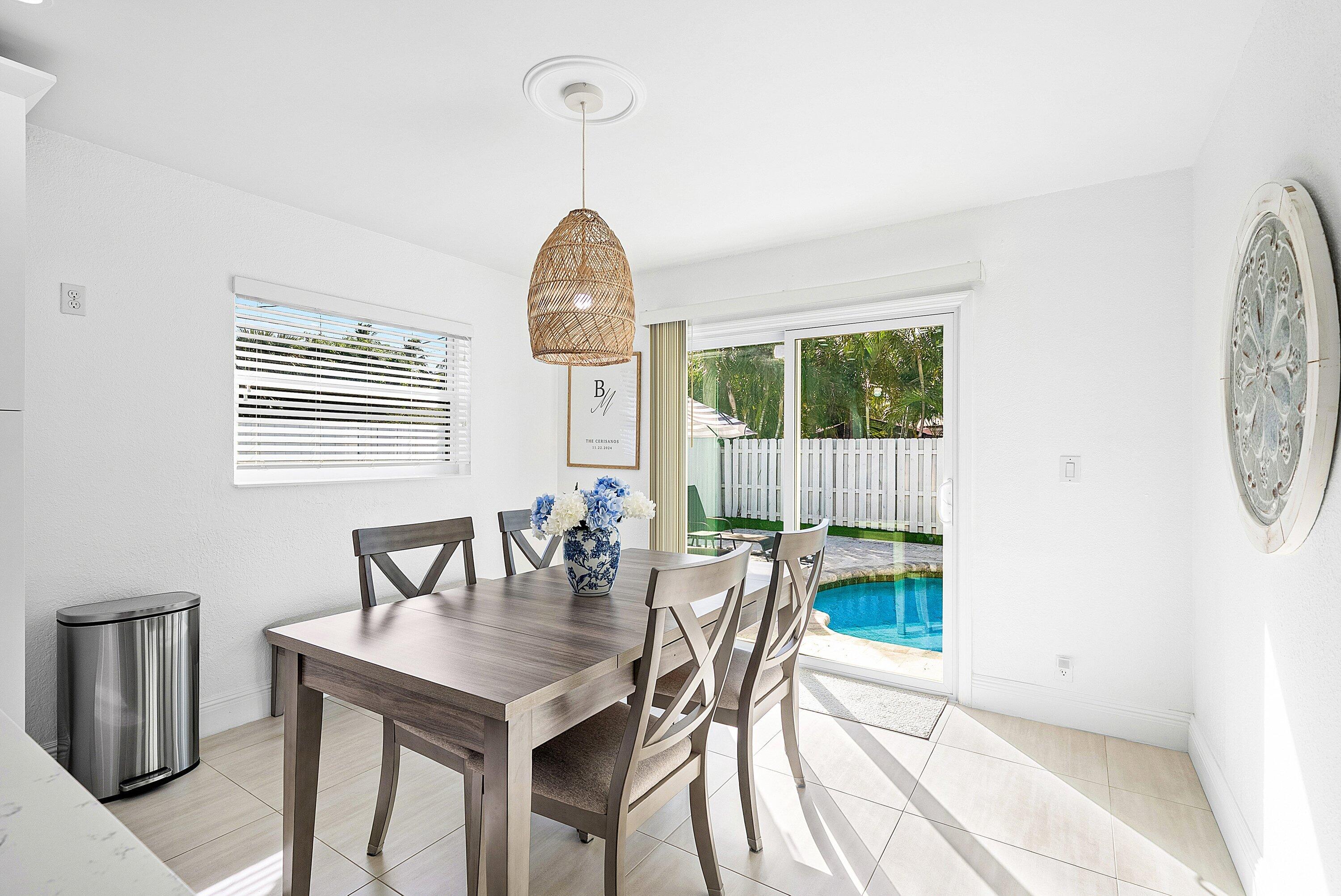 124 Oregon Lane Boca Raton, FL 33487 - Photo 9 of 41 a view of a dining room with furniture