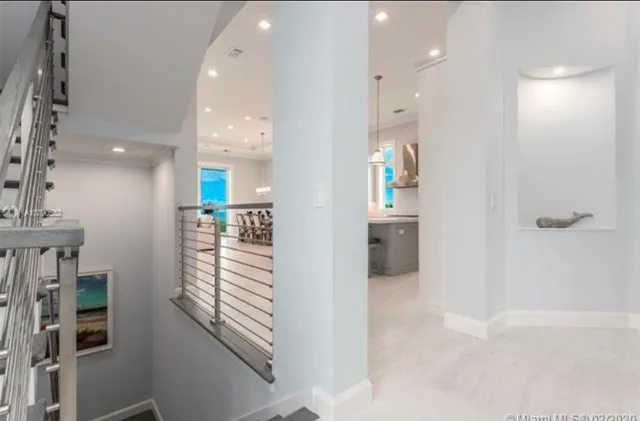 a large kitchen with lots of counter space and windows