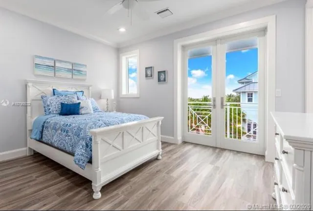 a bathroom with a double vanity sink toilet and shower