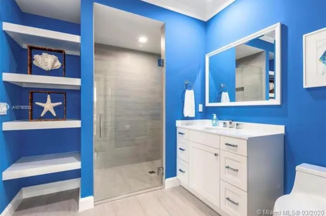 a bathroom with a bathtub and shower