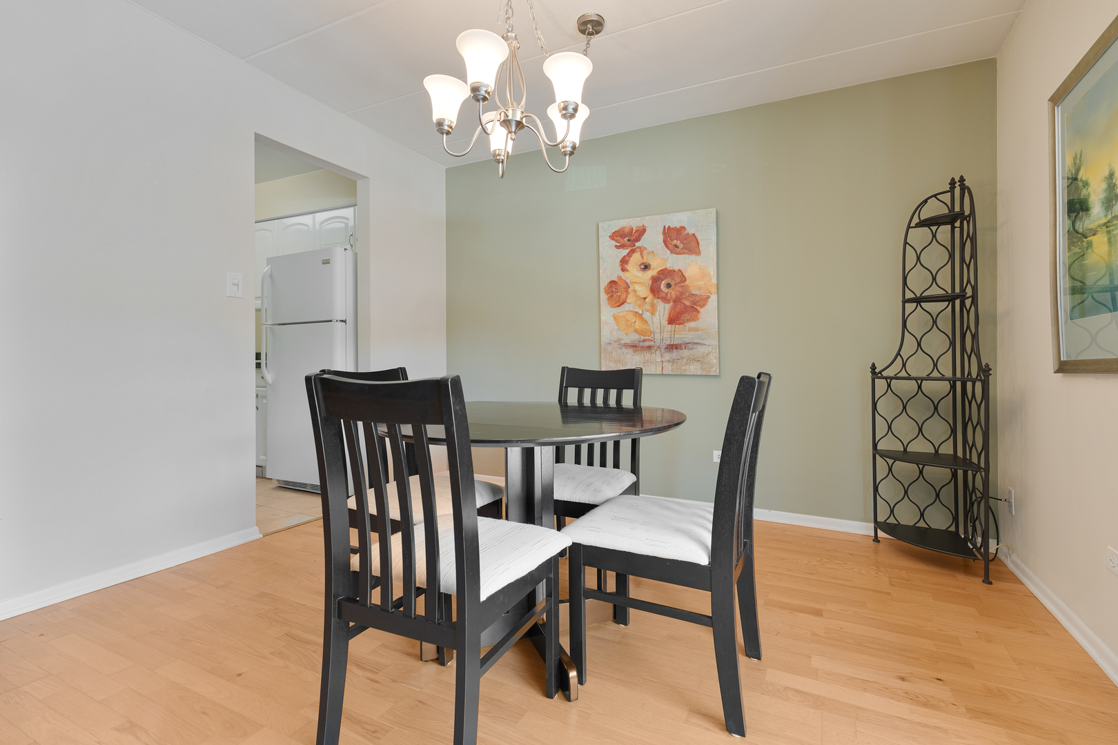 6443 Clarendon Hills Road, Unit 206 Willowbrook, IL 60527 - Photo 6 of 21 a view of a dining room with furniture and wooden floor
