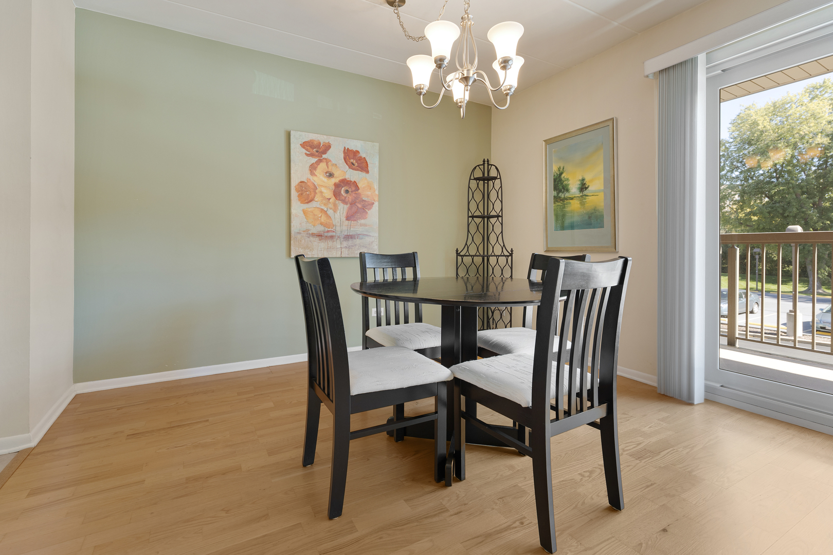 6443 Clarendon Hills Road, Unit 206 Willowbrook, IL 60527 - Photo 7 of 21 a view of a dining room with furniture a chandelier and wooden floor