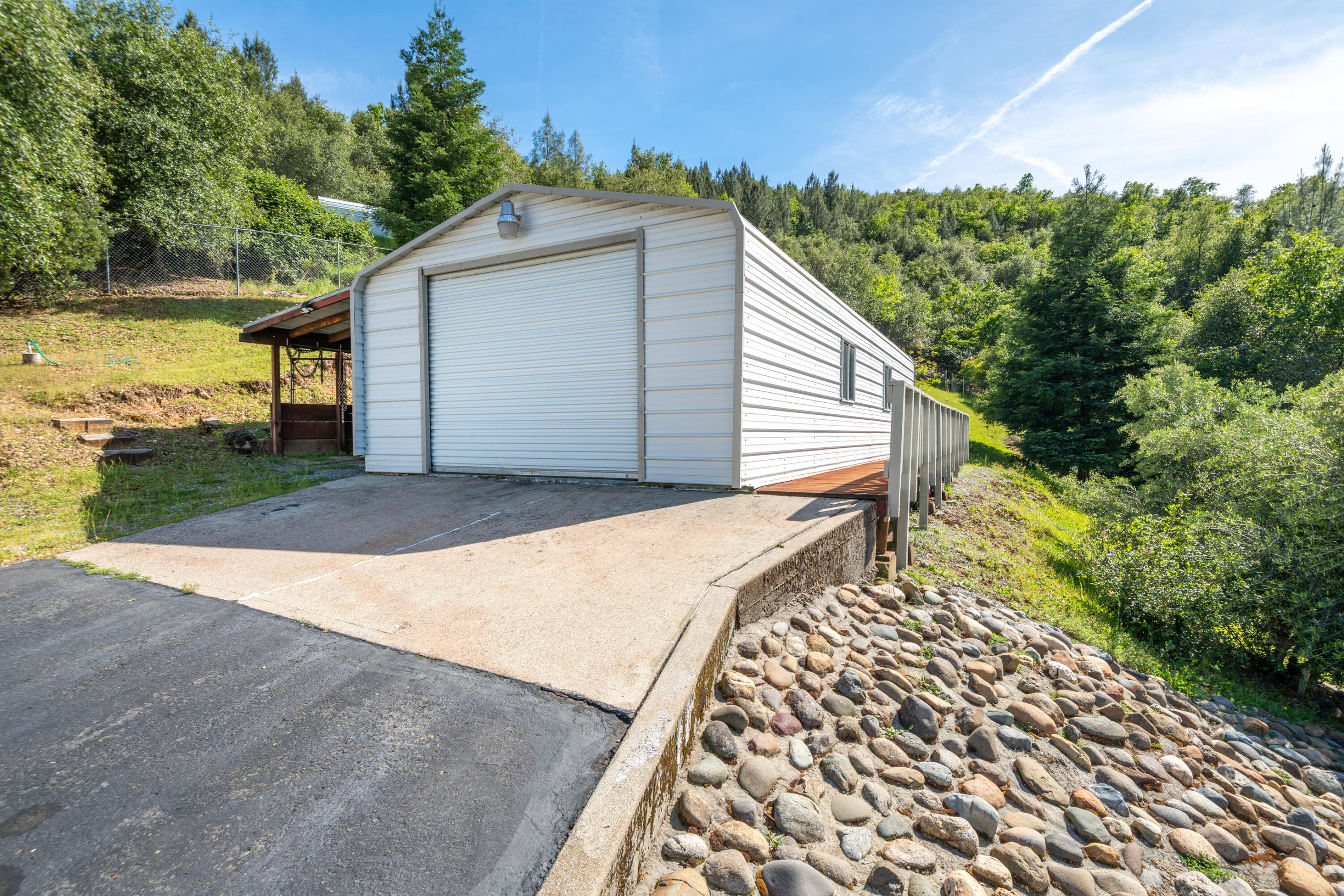 22151 Ravine Court Redding, CA 96003 - Photo 27 of 34 a view of a backyard with a garden
