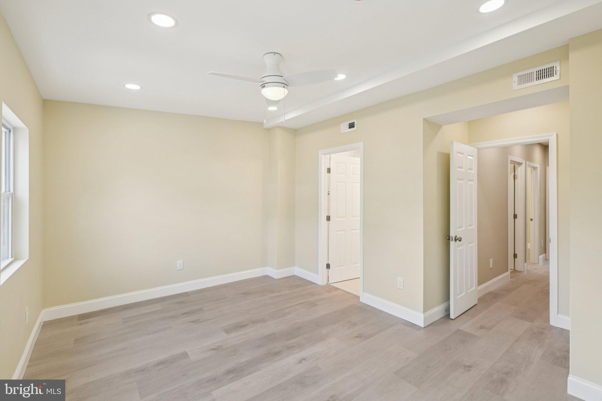 729 Madison Street Northwest Washington, DC 20011 - Photo 21 of 59 wooden floor in an empty room with a window