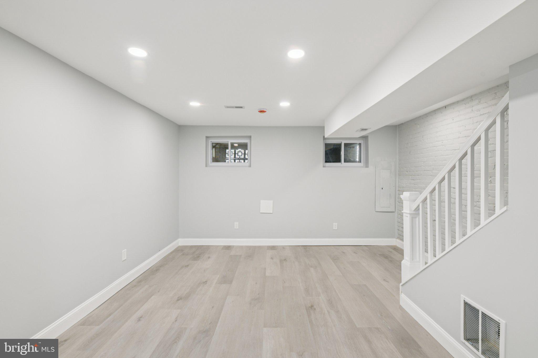 729 Madison Street Northwest Washington, DC 20011 - Photo 45 of 59 a view of room with stairs and wooden floor