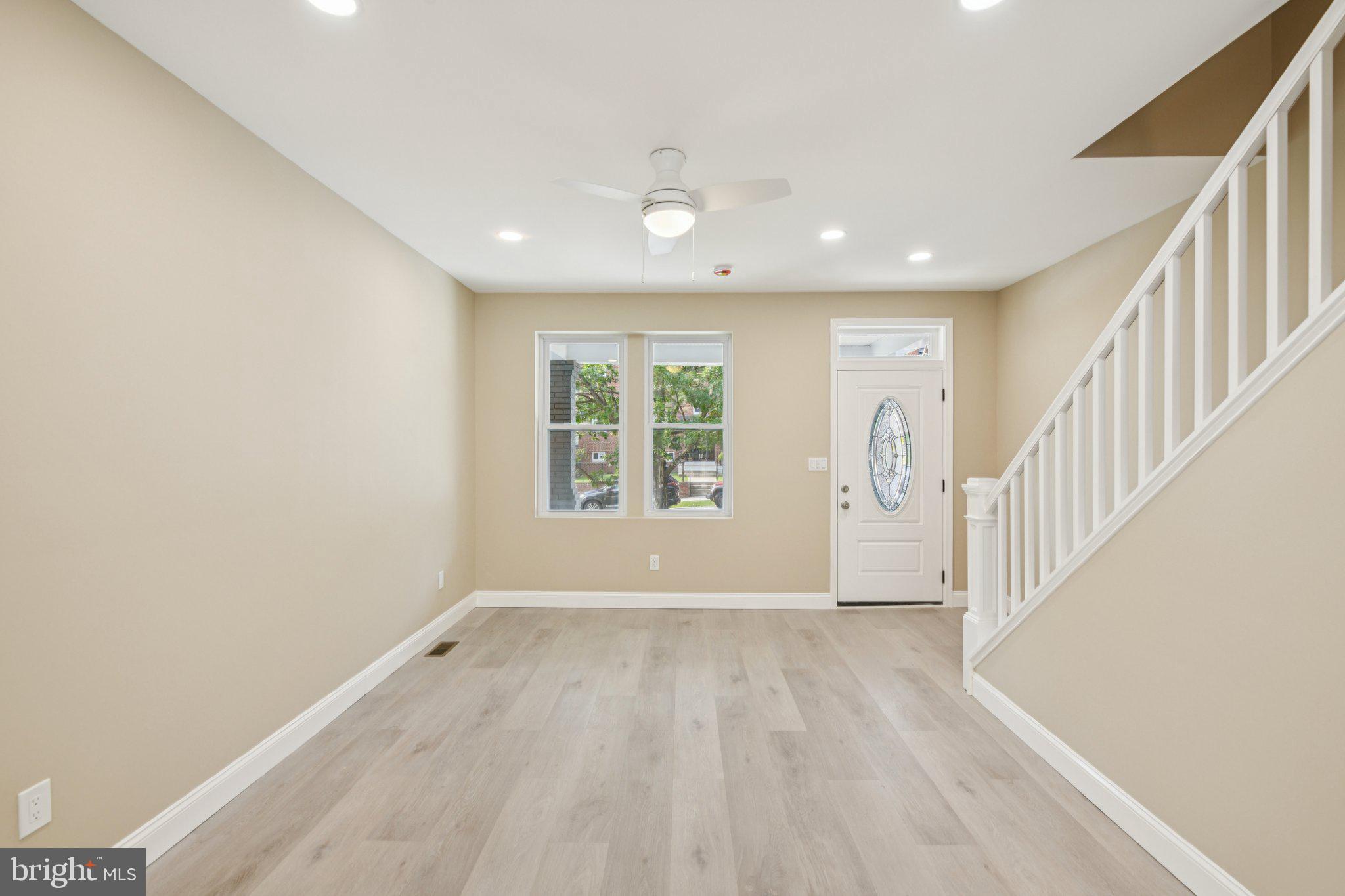 729 Madison Street Northwest Washington, DC 20011 - Photo 5 of 59 a view of an empty room with wooden floor and a window