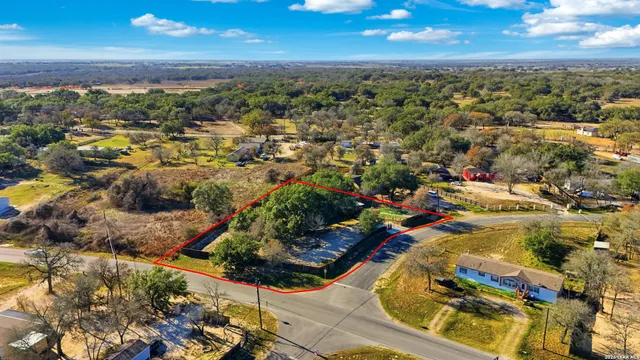 an aerial view of residential houses with outdoor space