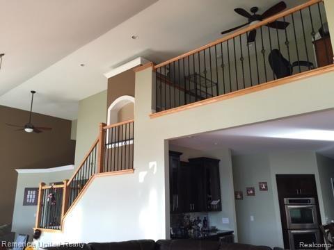 3467 East Commerce Road Commerce Township, MI 48382 - Photo 8 of 36 Stairway to upper level loft and bedrooms.