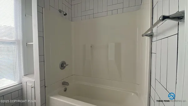 a bathroom with a bathtub