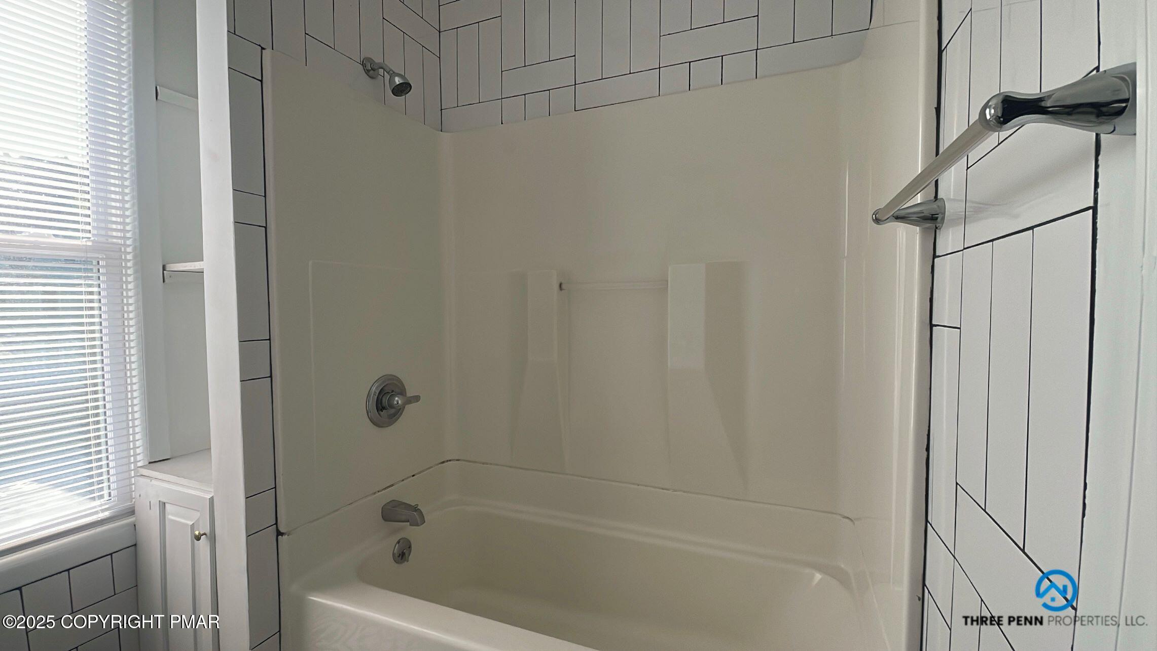 100 Broad Street, Unit B Stroudsburg, PA 18360 - Photo 13 of 18 a bathroom with a bathtub