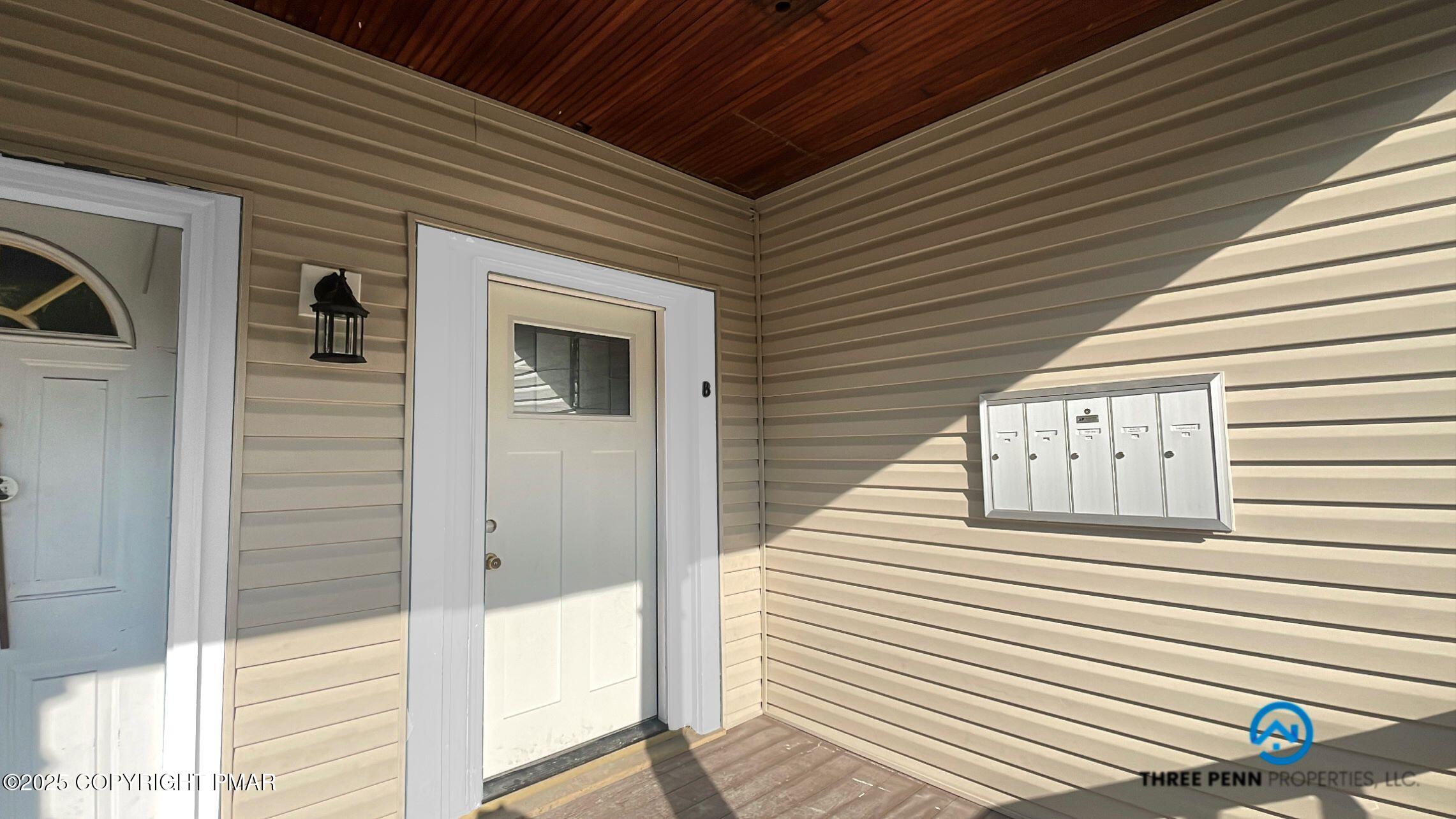 100 Broad Street, Unit B Stroudsburg, PA 18360 - Photo 2 of 18 a view of a two chairs in the balcony
