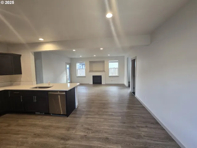 a view of kitchen with wooden floor