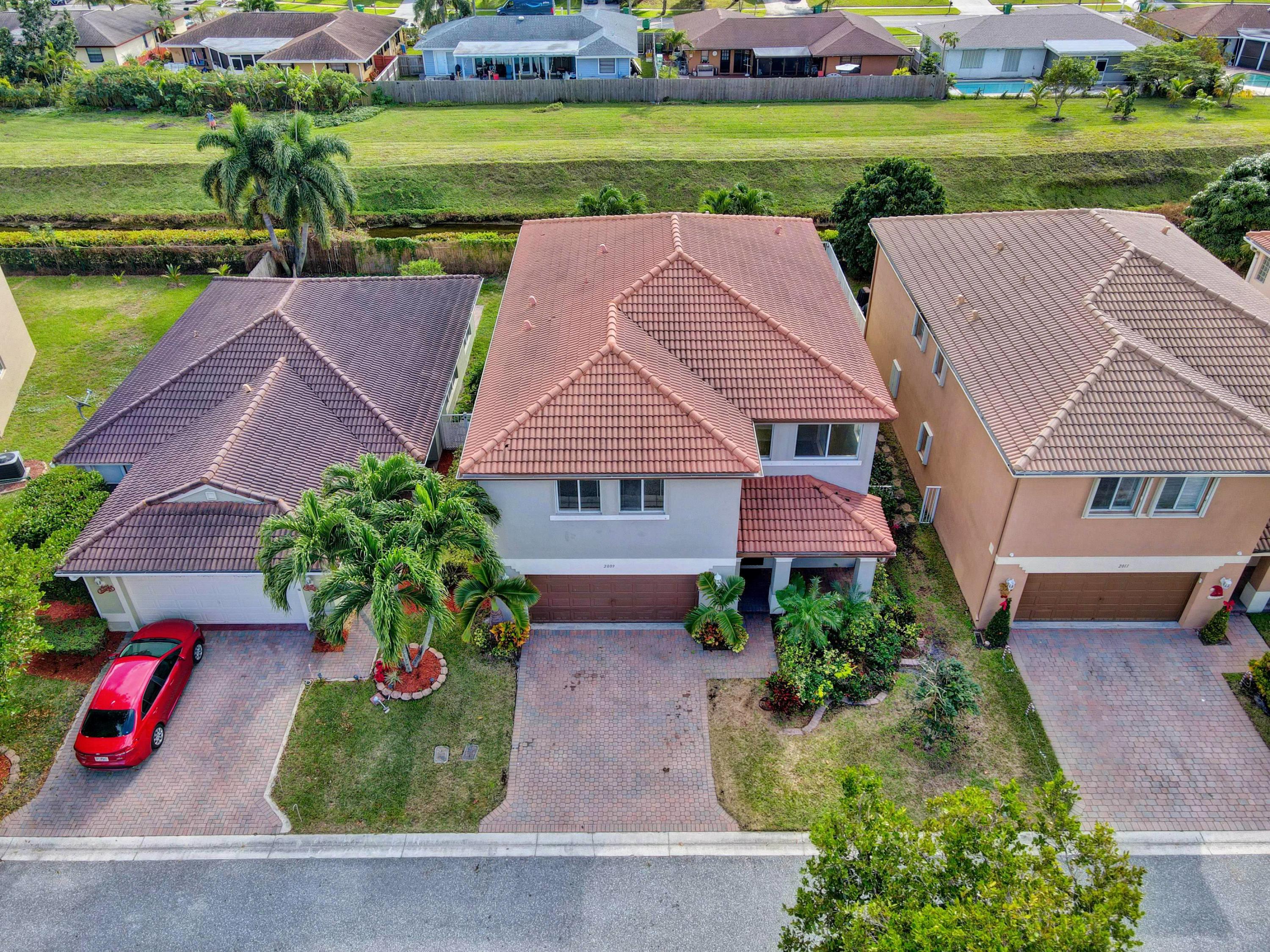 2009 Little Torch Street Riviera Beach, FL 33407 - Photo 76 of 79 76_dji_0307_08_09_10_11_airmagic_process