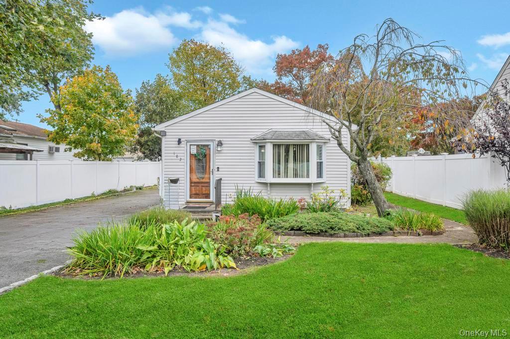 182 Commack Road Deer Park, NY 11729 - Photo 2 of 24 a view of a house with garden