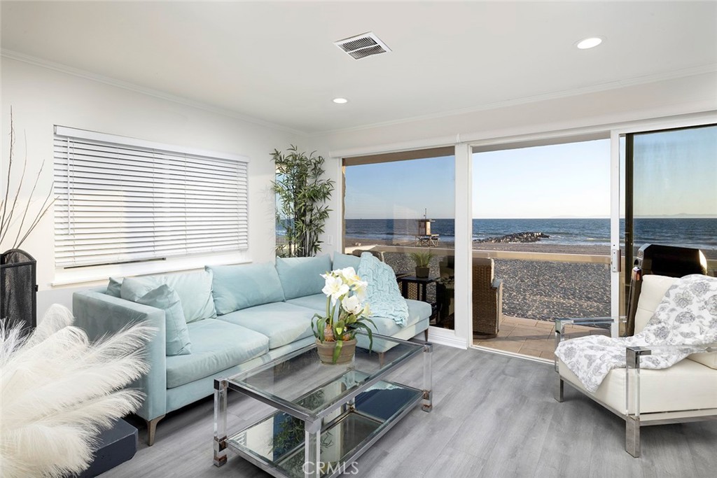 4005 Seashore Drive Newport Beach, CA 92663 - Photo 16 of 32 a living room with furniture and a large window