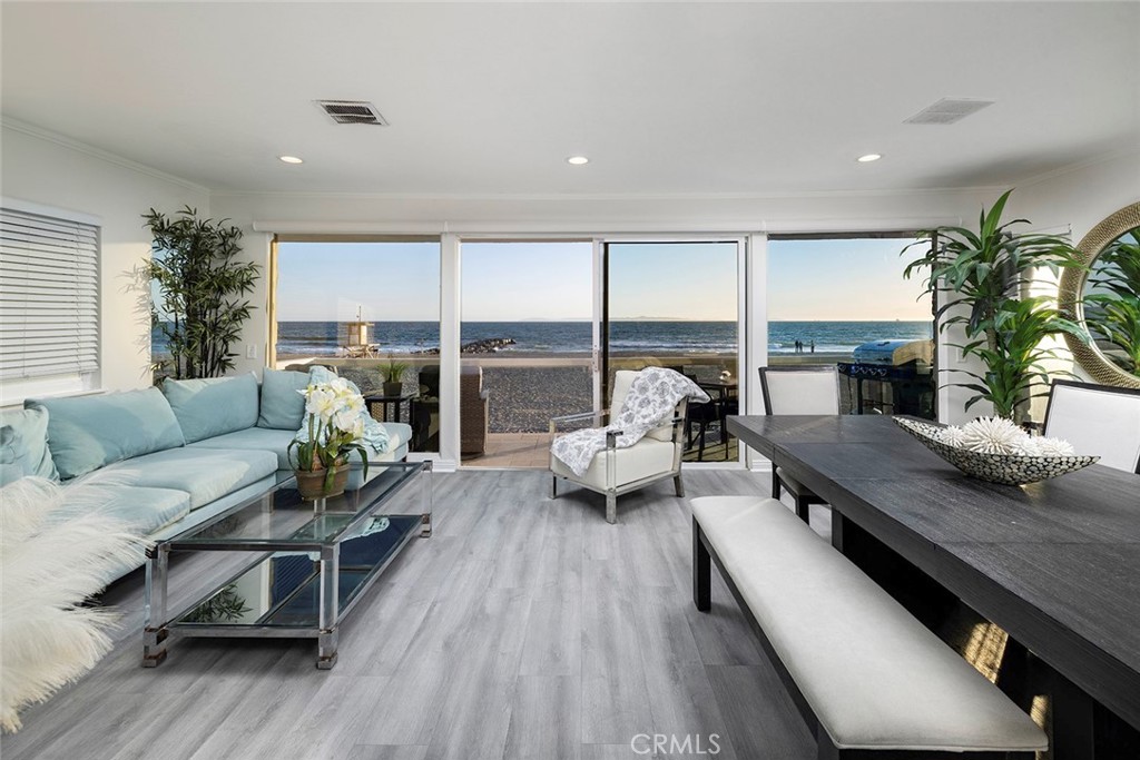 4005 Seashore Drive Newport Beach, CA 92663 - Photo 17 of 32 a living room with furniture and a large window