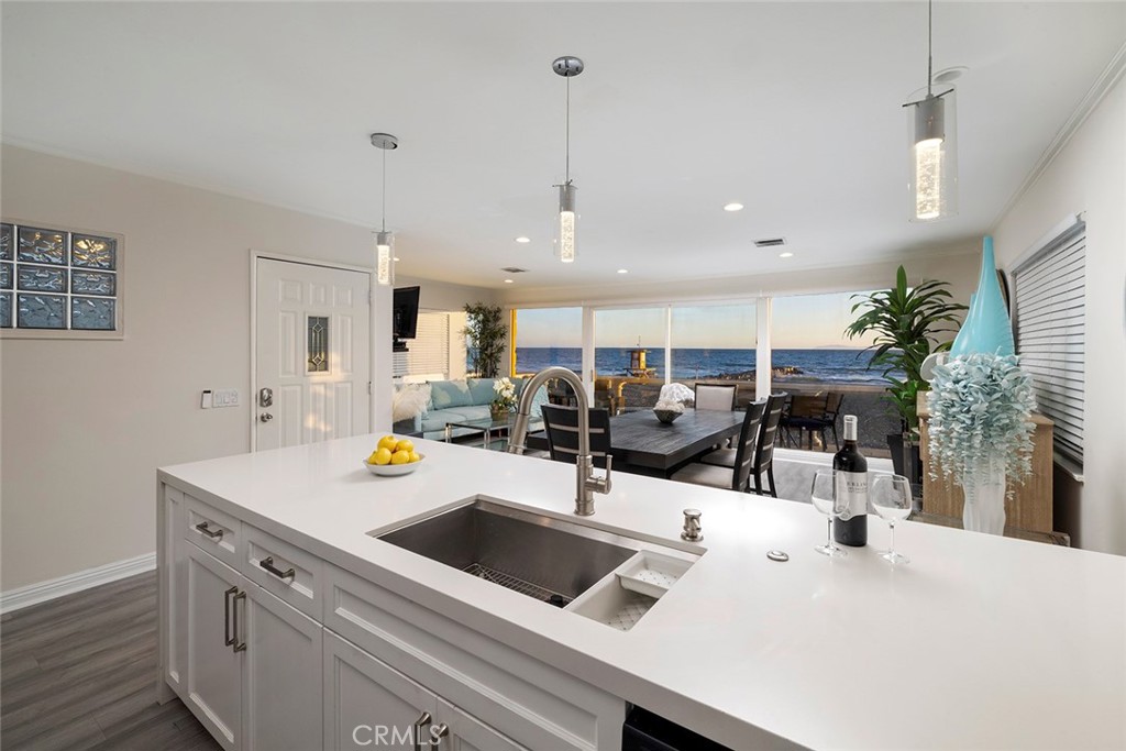 4005 Seashore Drive Newport Beach, CA 92663 - Photo 20 of 32 a view of a kitchen with sink and living room