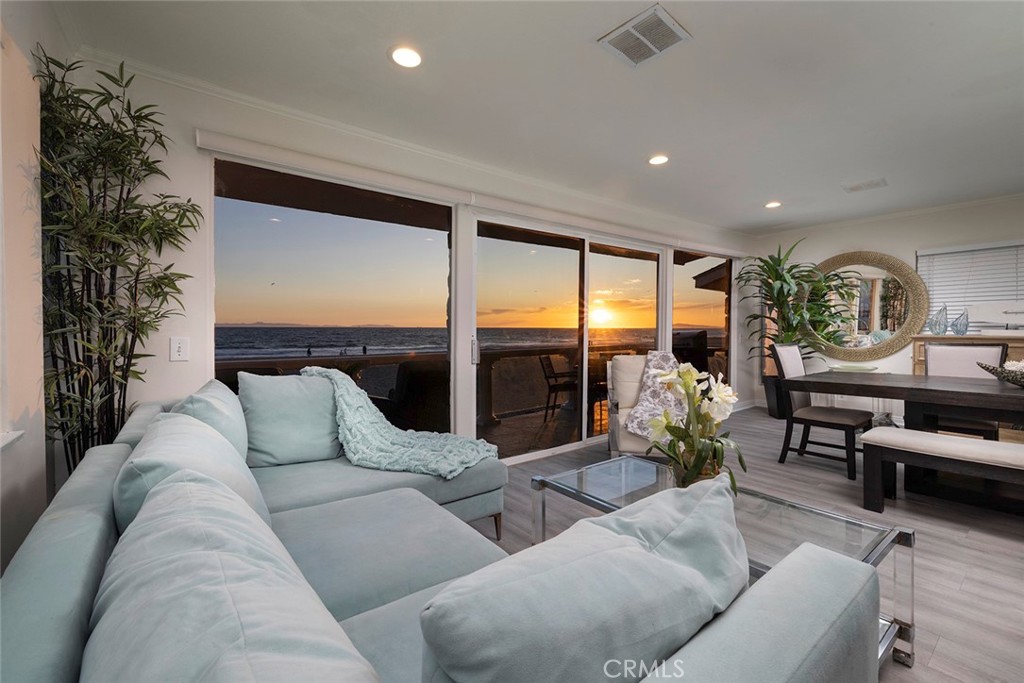 4005 Seashore Drive Newport Beach, CA 92663 - Photo 21 of 32 a living room with furniture and a large window